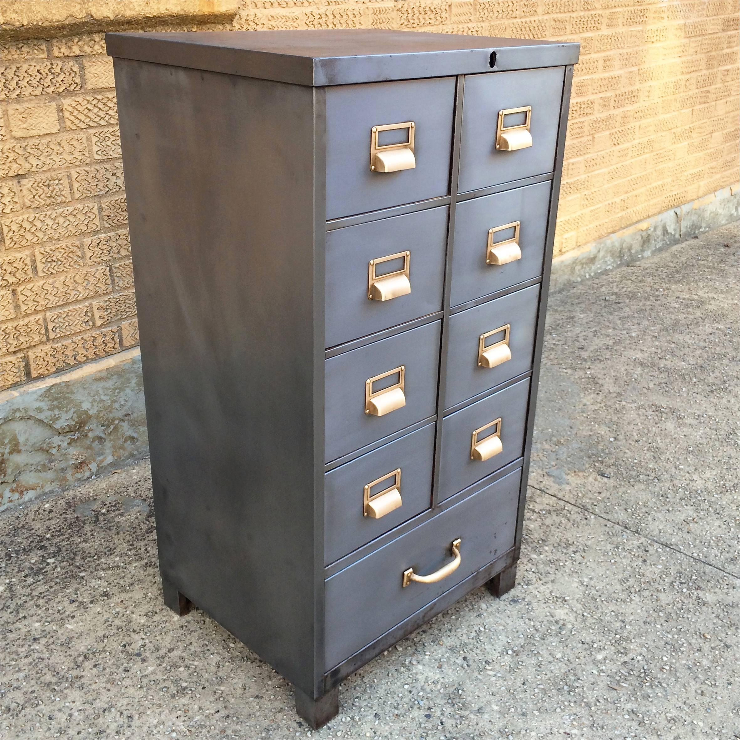 Mid-Century, hand-polished, brushed steel, 9 drawer, office, index file cabinet with polished brass hardware by Cole Steel.

Index drawers measures 8