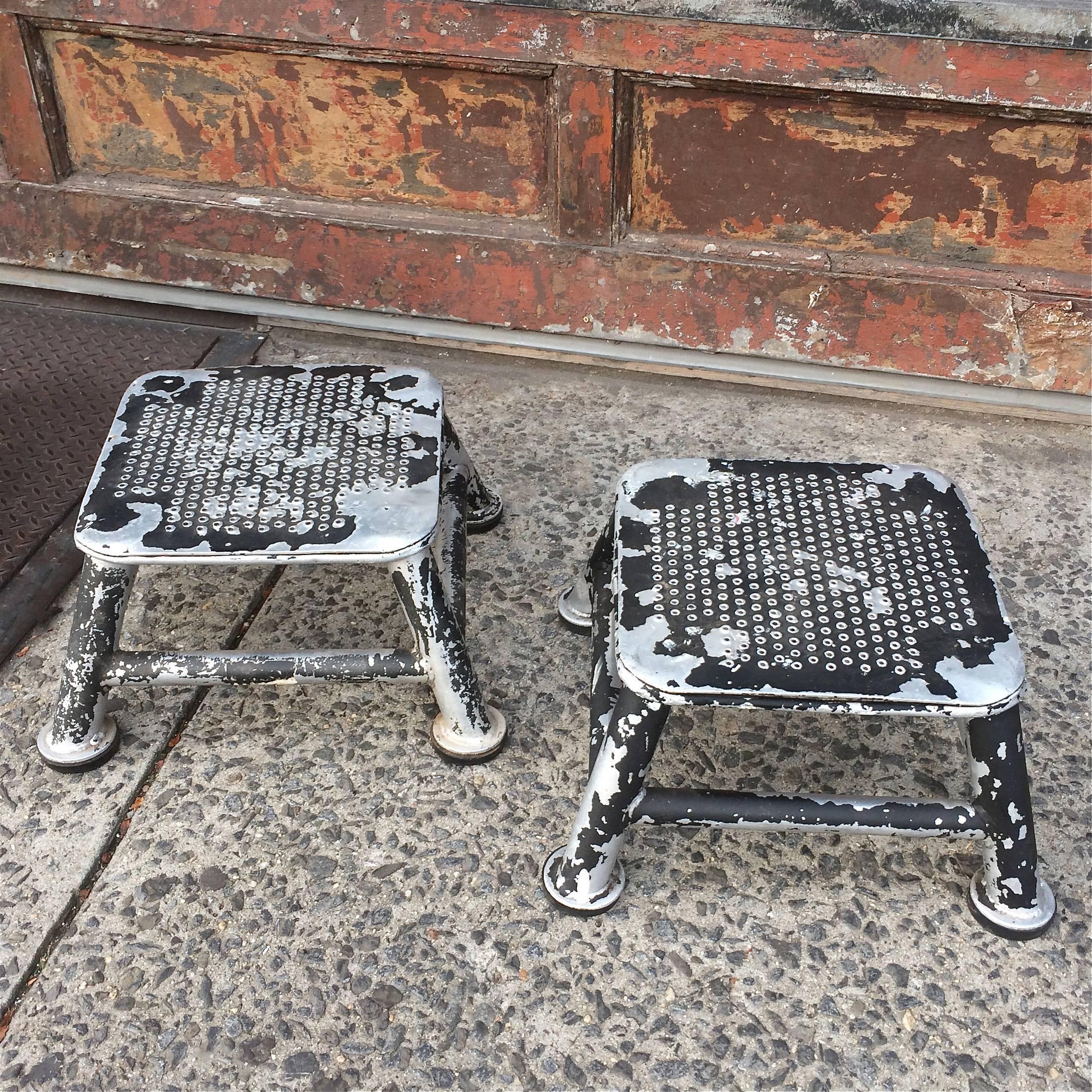 Industrial, light weight, aluminum, train station, step stools in varying degrees of work worn patina. The stool's footprint is 20