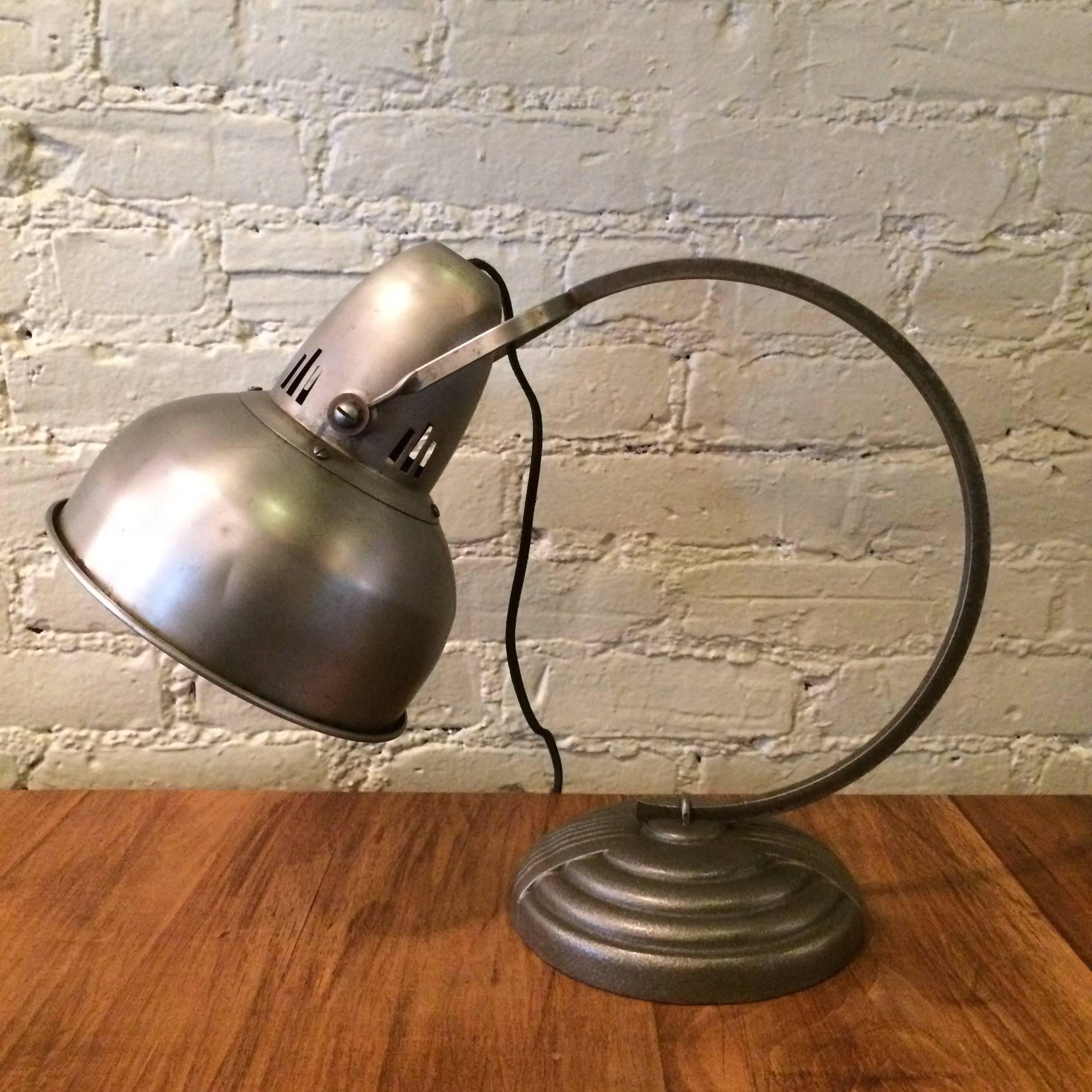 Art Deco, General Electric desk lamp with cast iron base, brushed steel stem and shade that rotates. The lamp is newly wired with cloth cord and can take up to a 200 watt bulb. Shade diameter is 8