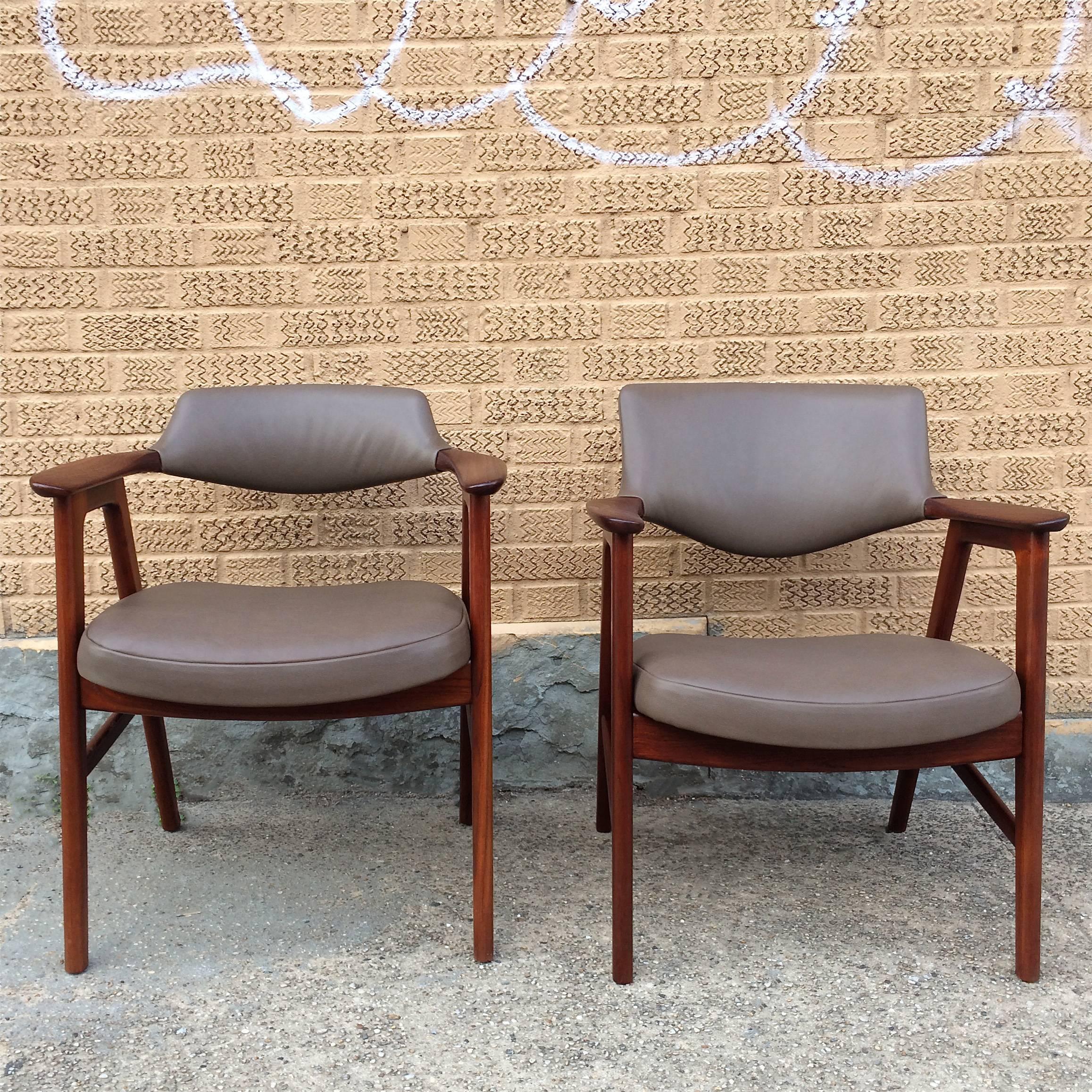 Pair of American midcentury, his and hers armchairs by The Gunlocke Company Inc are newly restored walnut frames with Italian calf skin leather seats and backs.

Measures: Left: 24