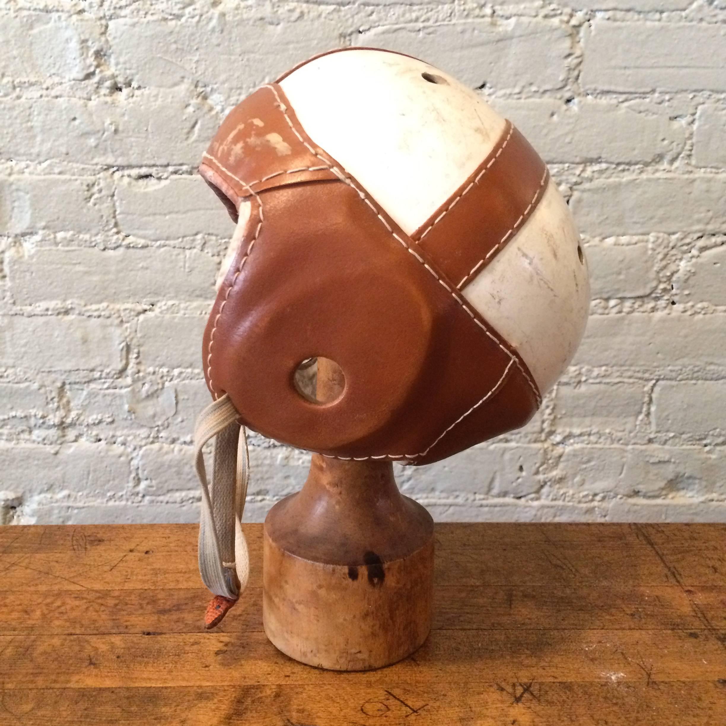American, junior, football leather head helmet by J G Higgins sporting goods, circa 1930s.