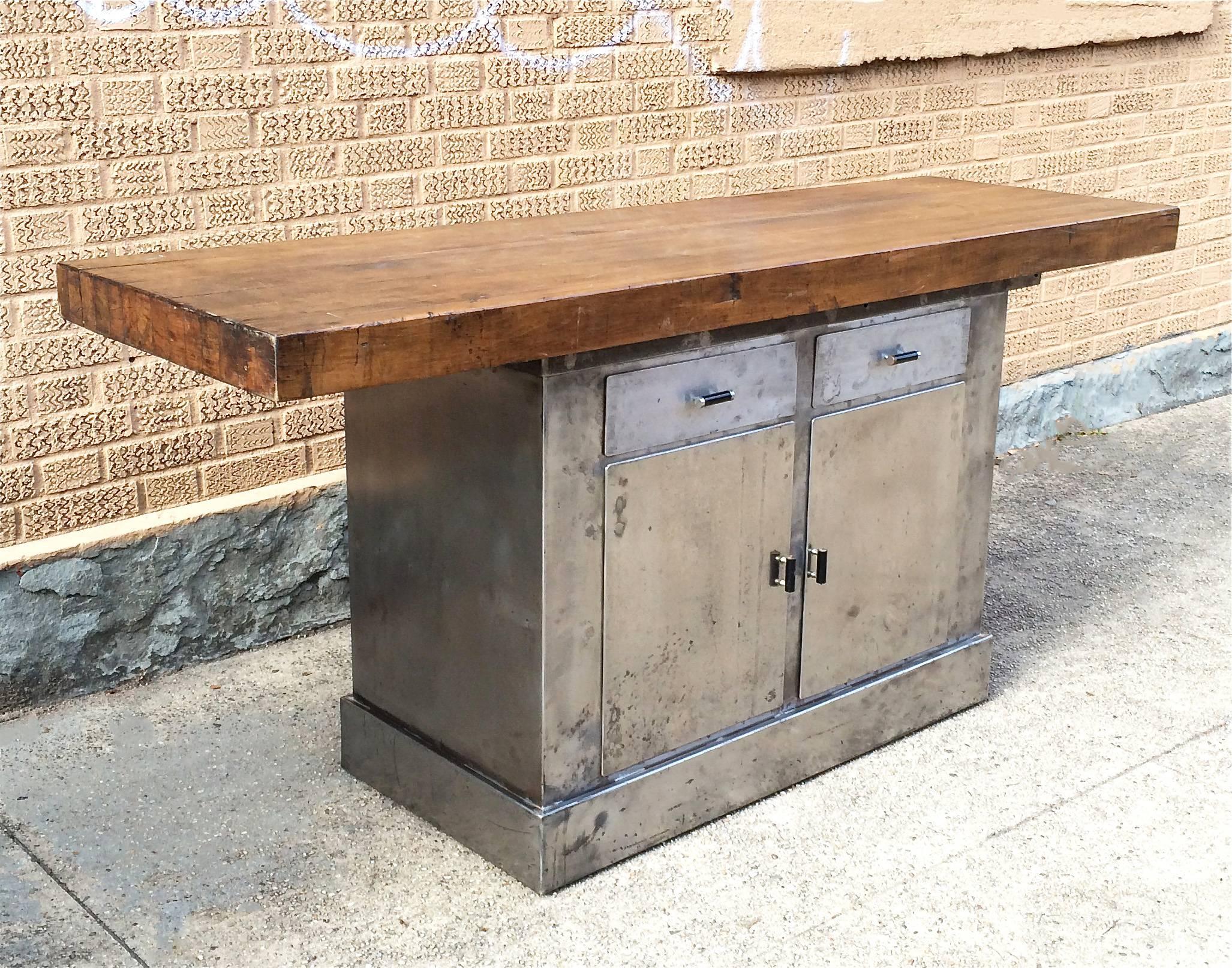 Custom, Industrial island or work table features 3″ thick, reclaimed maple butcher block surface atop 1920s brushed steel cabinet with bakelite pulls, assembled by cityFoundry in Brooklyn for our CF signature line.
