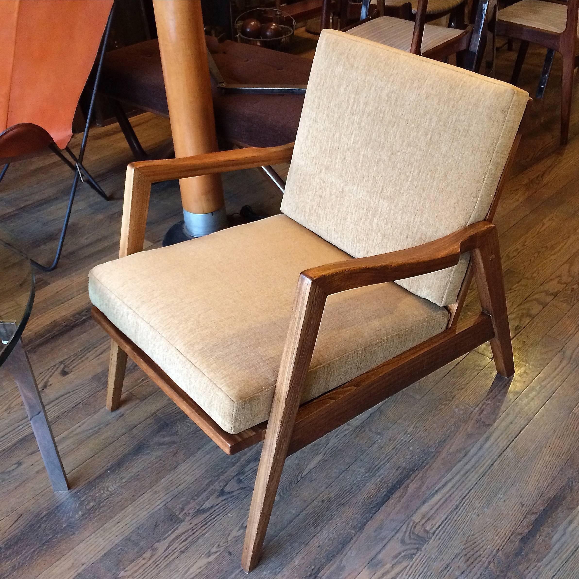 Handsome, Mid-Century Modern, lounge chair features a newly finished, nicely detailed, sculptural, birchwood frame and new cushions upholstered in tan chenille.