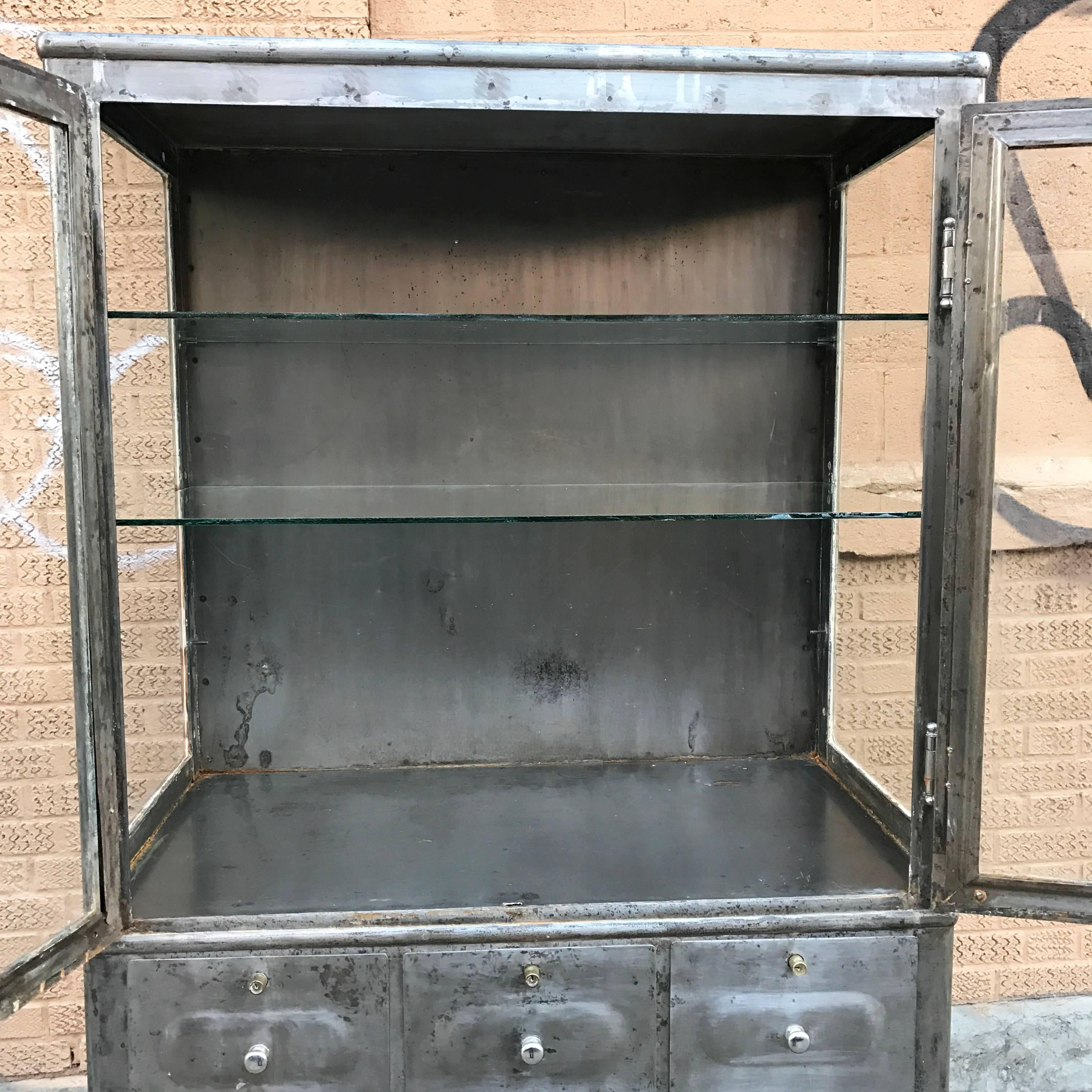 Early 20th Century Industrial Brushed Steel Double Door Apothecary Display Cabinet