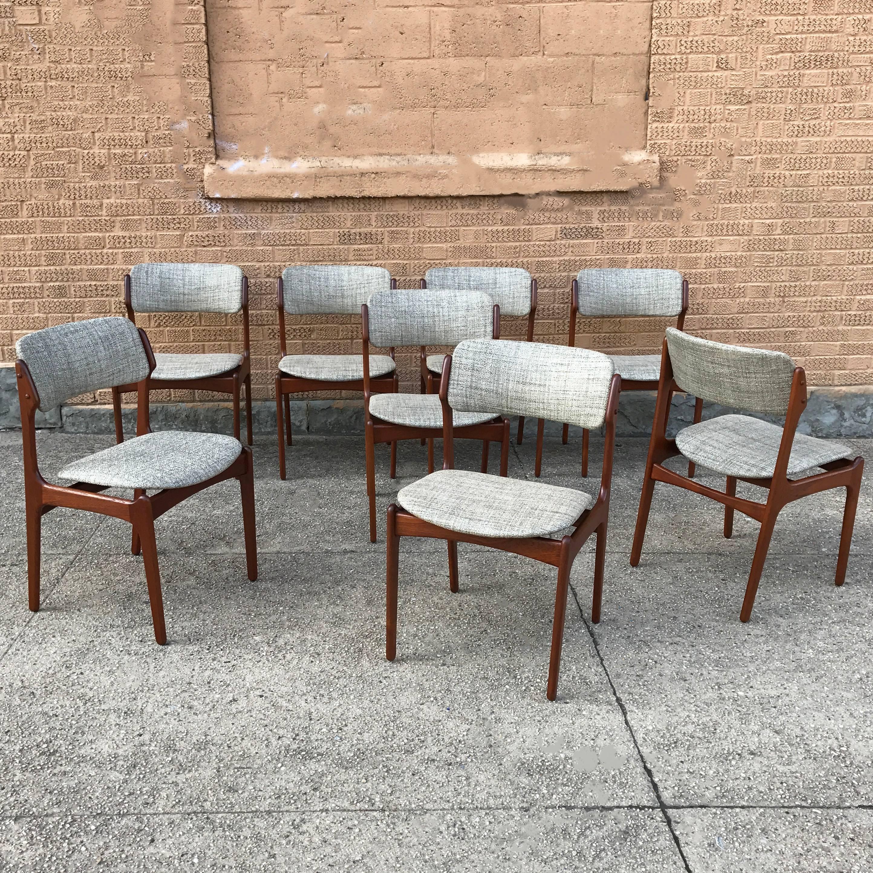 Set of eight, teak dining chairs by Erik Buck for O.D. Mobler are newly restored with seats and backs upholstered in grey blue tweed linen blend.