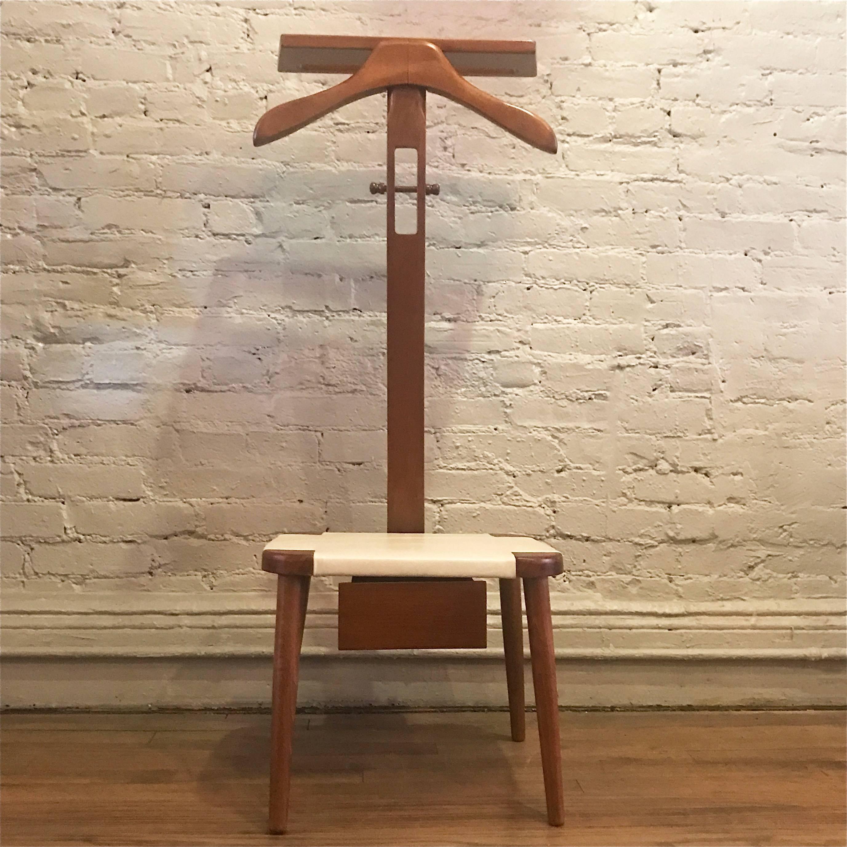 American, Mid-Century Modern, maple, valet chair or butler features a newly upholstered white leather seat and storage drawer below.