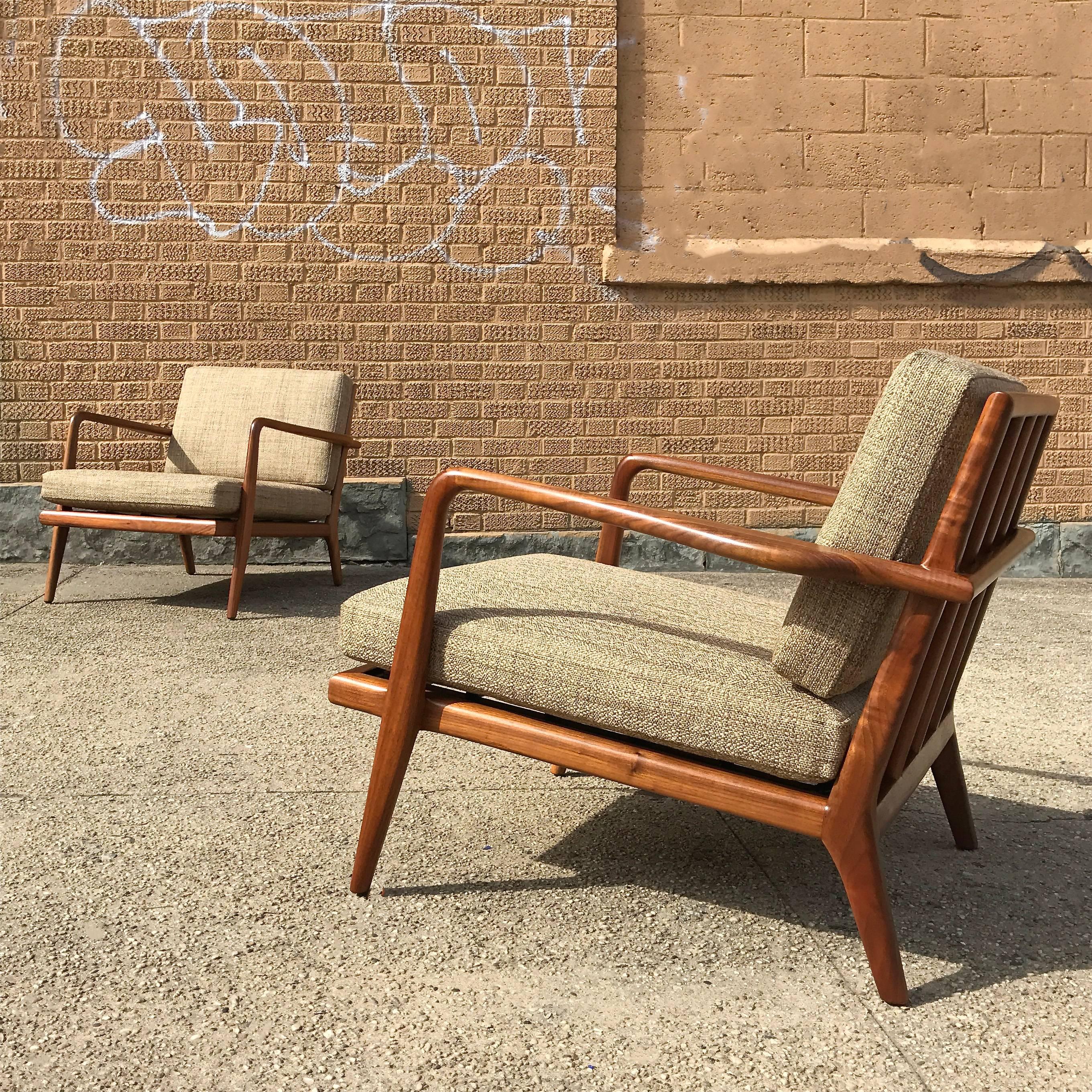 Pair of fantastic, Mid-Century Modern, lounge chairs by Mel Smilow feature solid walnut frames with rail backs and cushions newly upholstered in beige linen blend.