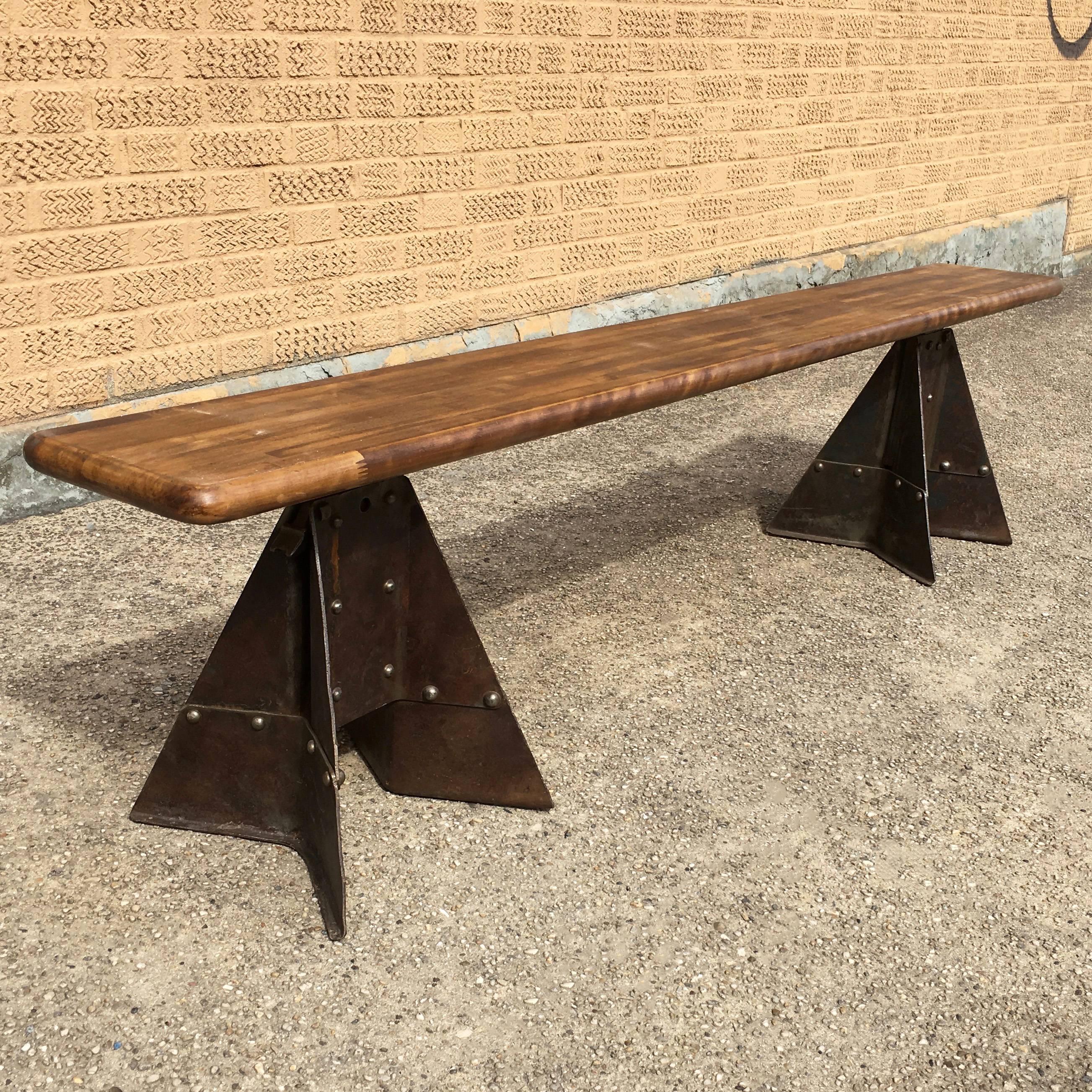 CF Signature, height adjustable, Industrial bench featuring a 9? Deep, reclaimed, segmented, maple butcher block top and vintage, 1940s, riveted, pressed steel, construction bases custom-made in Brooklyn, NY. Height is adjustable from 17 - 23