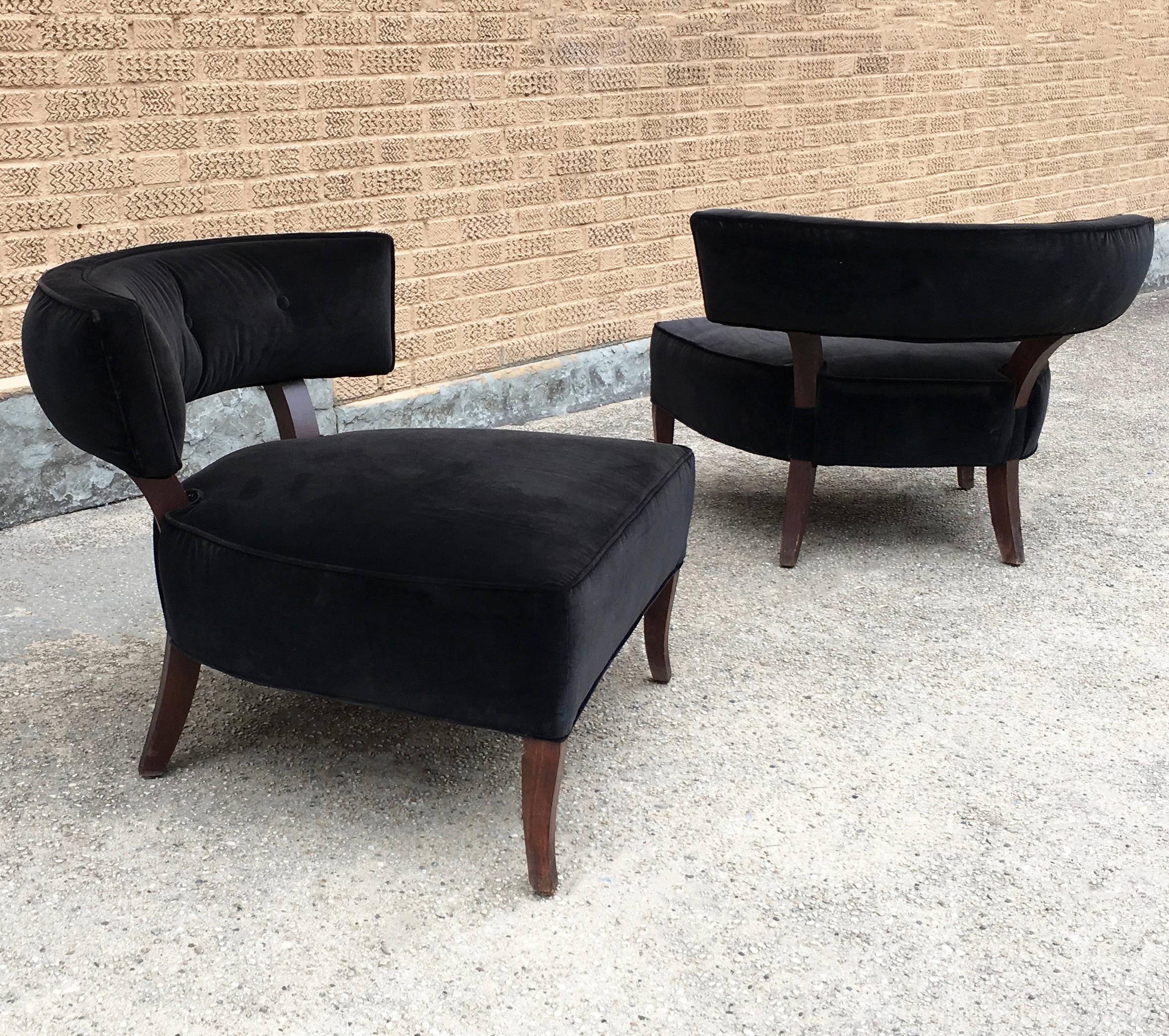 Pair of Hollywood Regency, slipper, hostess chairs upholstered in black velvet with maple frames feature curvaceous lines in the style of Billy Haines. Seat depth is 24