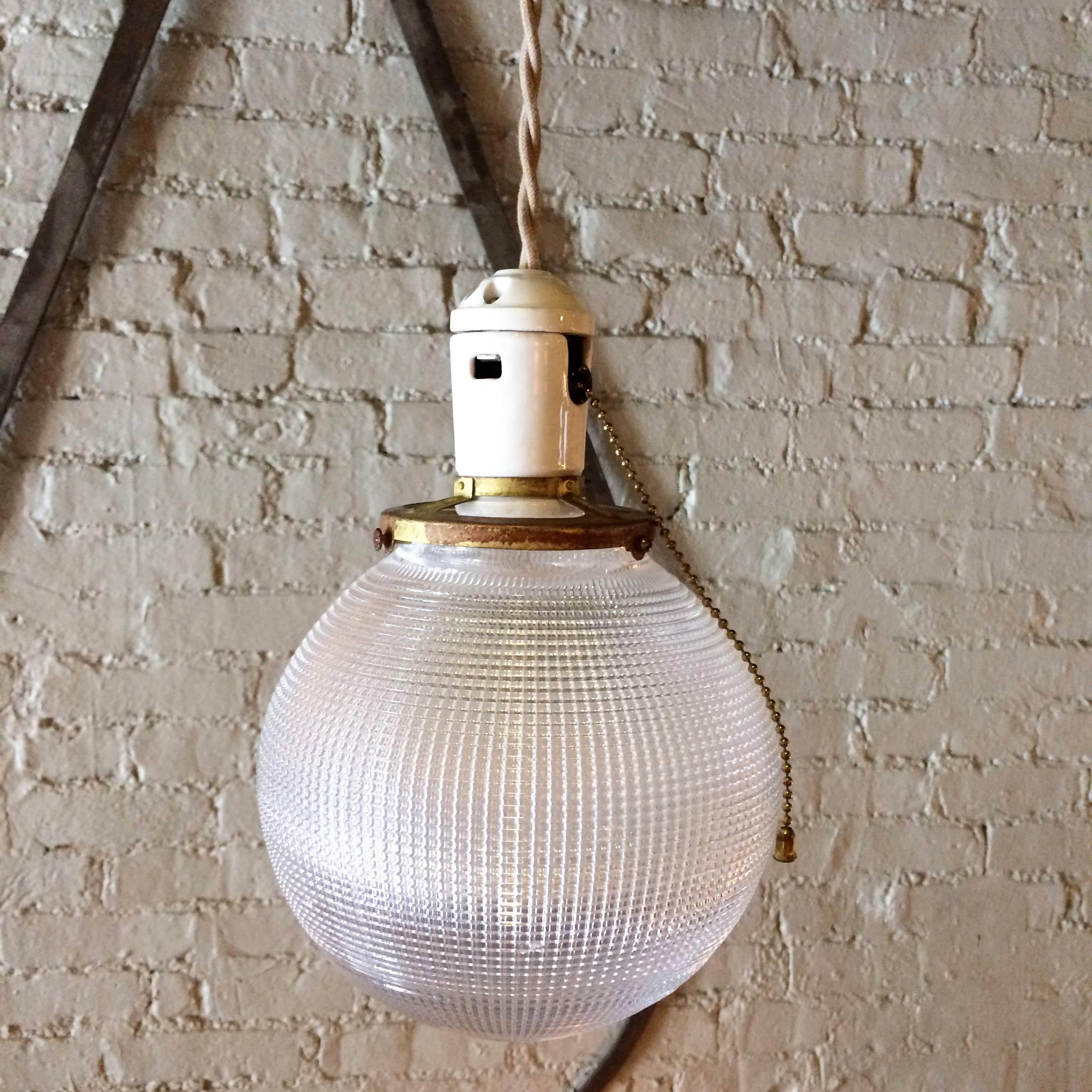 Pair of Industrial Holophane Glass Globe Pendant Lights In Excellent Condition For Sale In Brooklyn, NY