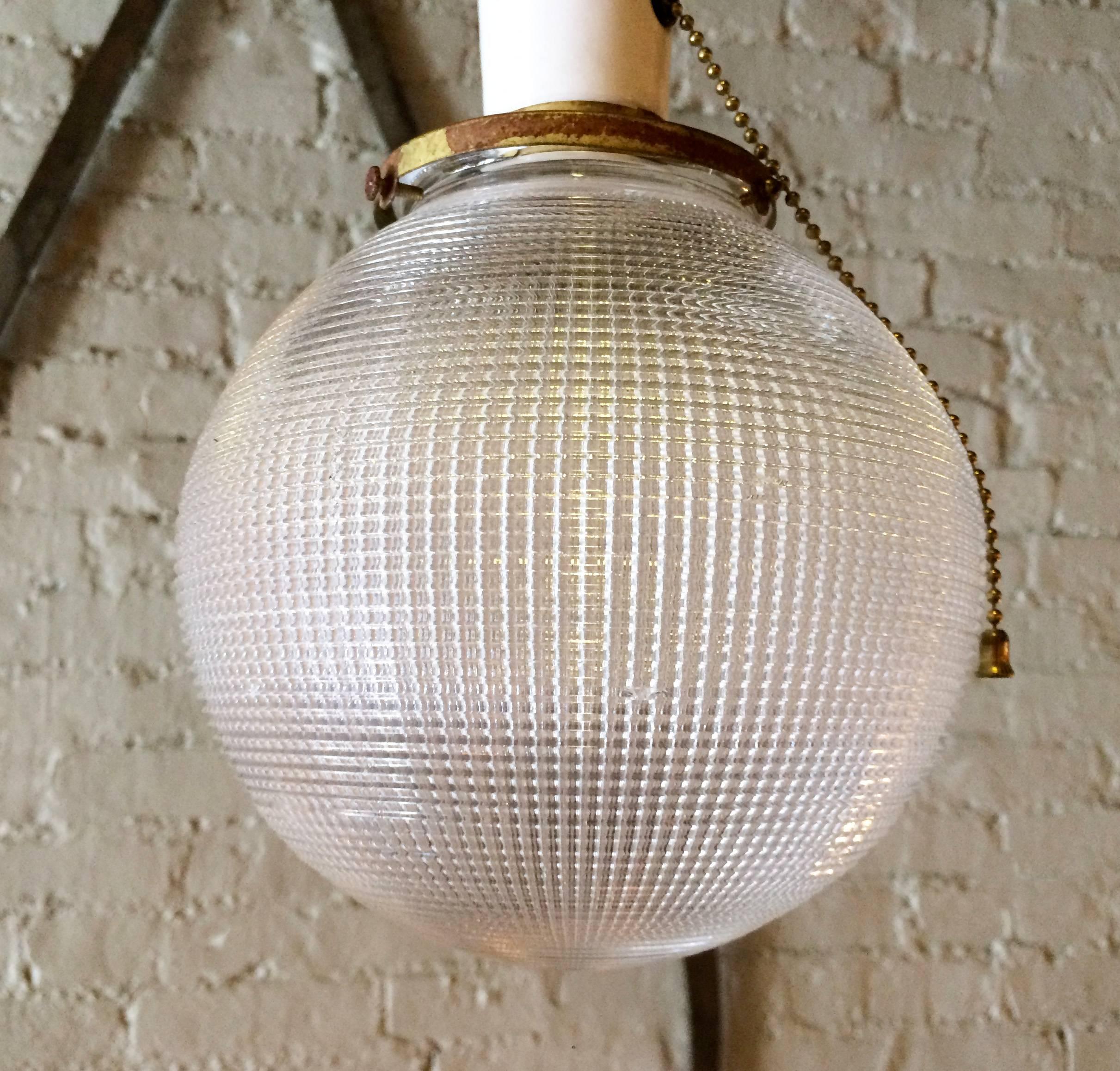 Mid-20th Century Pair of Industrial Holophane Glass Globe Pendant Lights For Sale