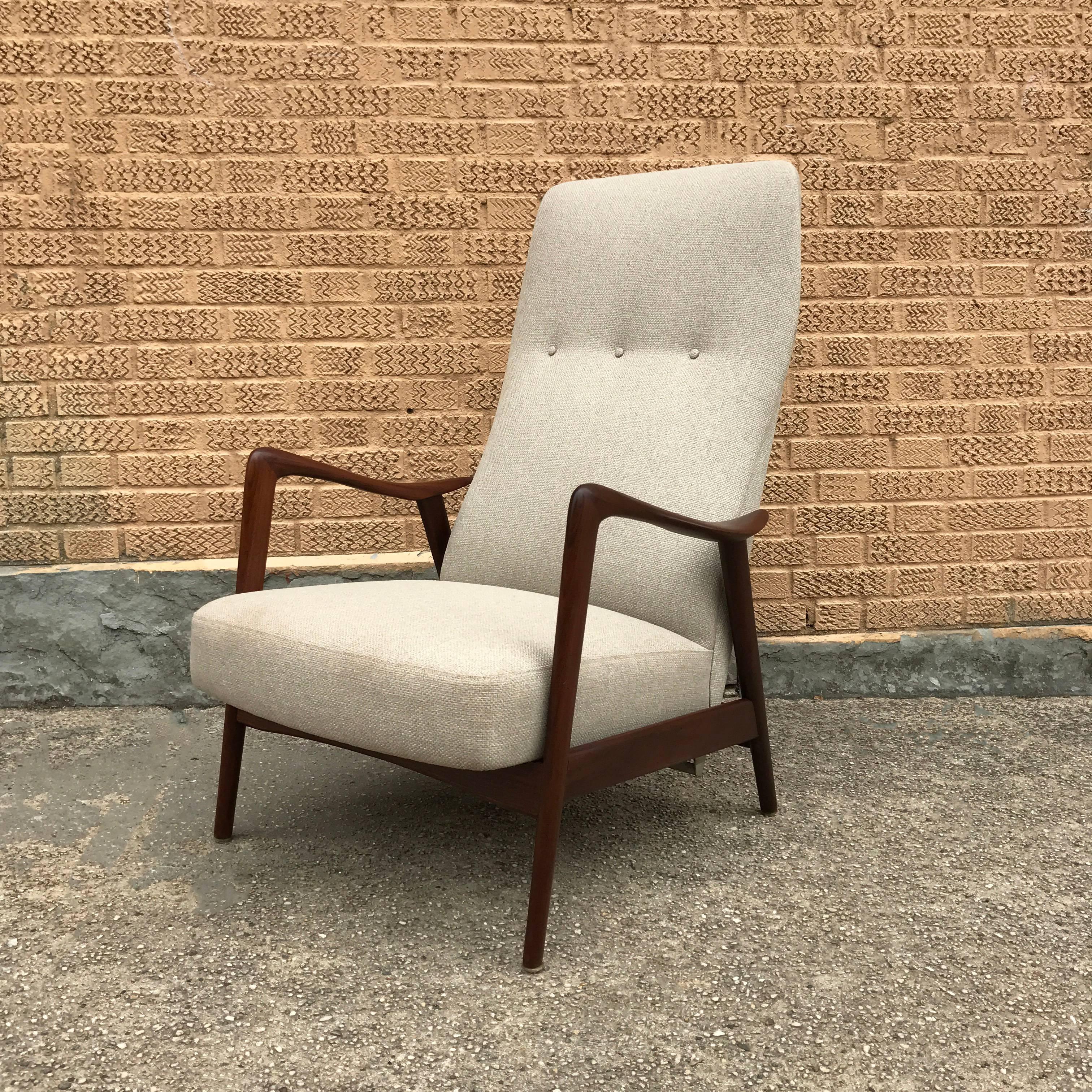 Scandinavian Modern, reclining lounge chair made in Norway and distributed by Westnofa, features a solid walnut frame and is newly upholstered in a woven cotton blend.