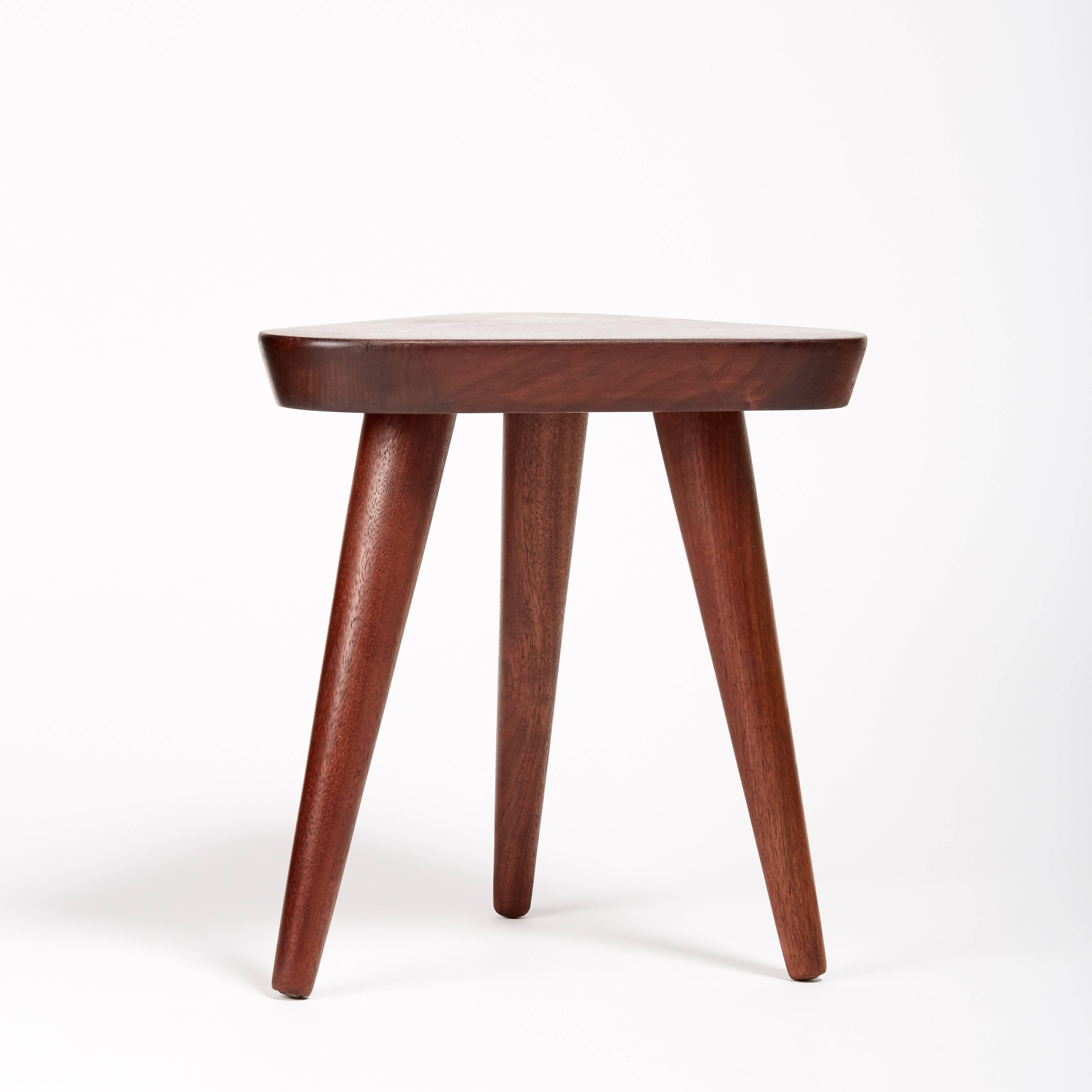 Sleek, Danish modern, teak, milking stool, foot stool on three tapered legs with aluminium inlay.