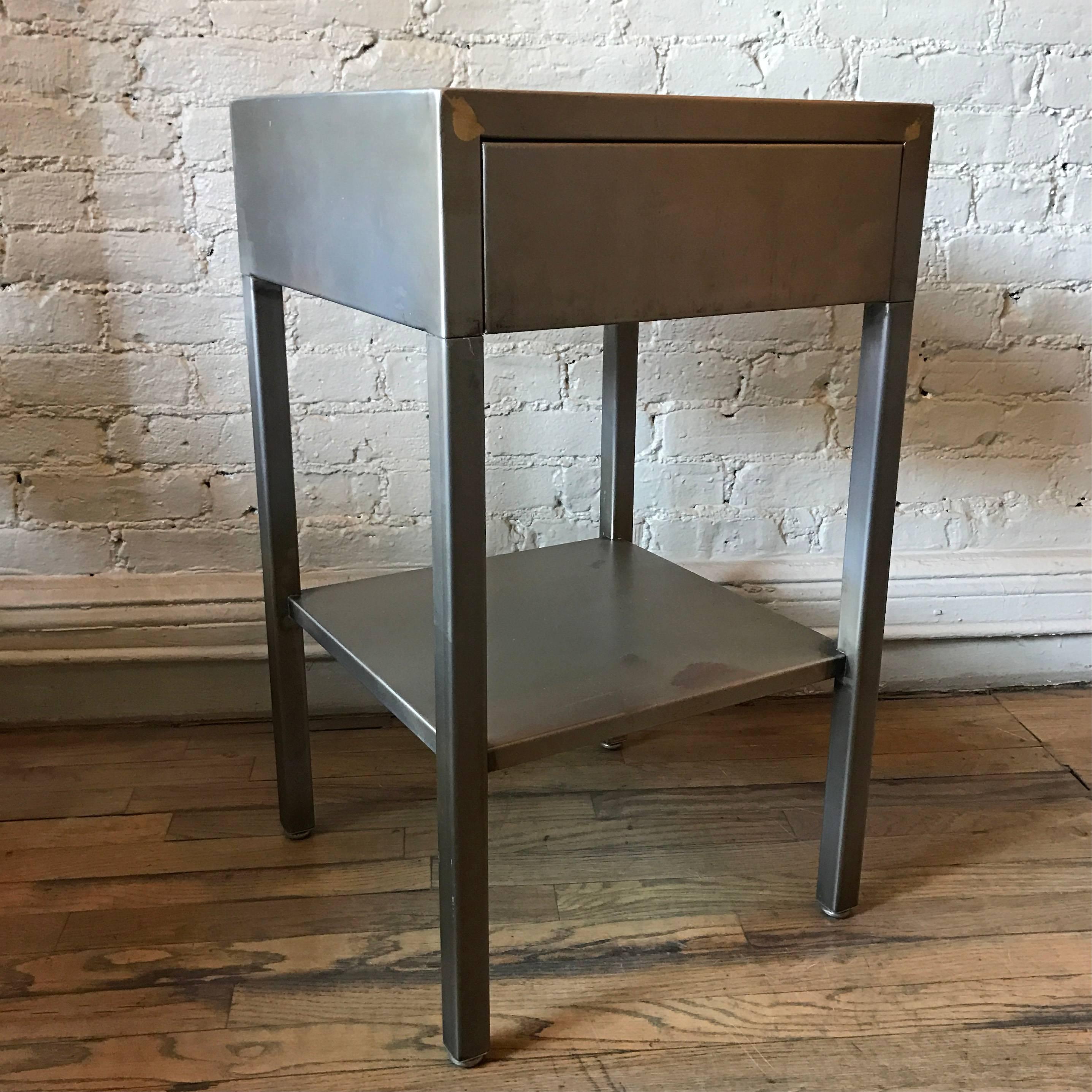 Mid-Century, Machine Age, Industrial, streamlined, side table or nightstand by Superior Sleeprite Corp, Chicago, IL is newly restored in a brushed steel finish.