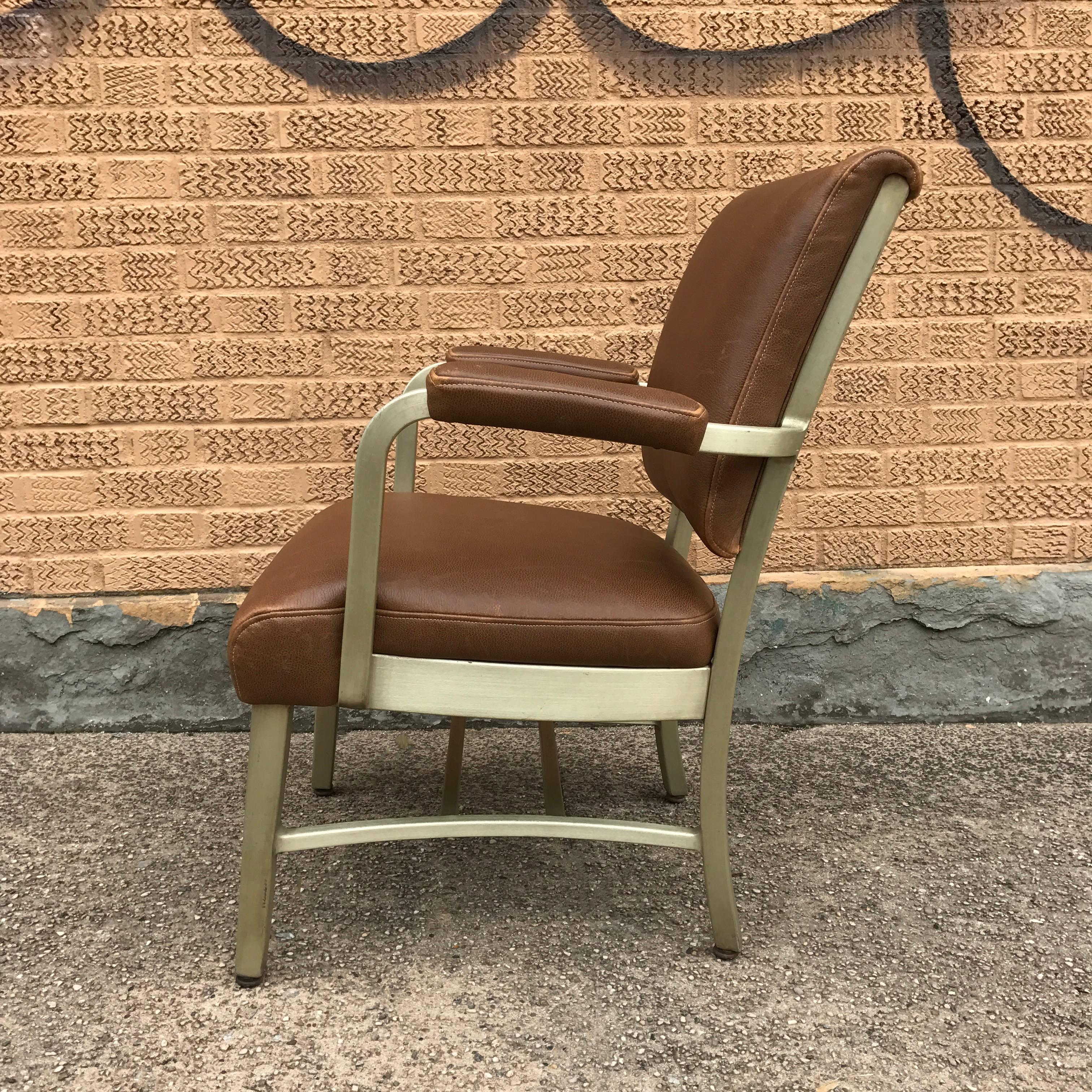 Industrial, Mid-Century armchair by GoodForm, The general Fireproofing Co. with aluminium frame is newly upholstered in medium tan/brown leather.