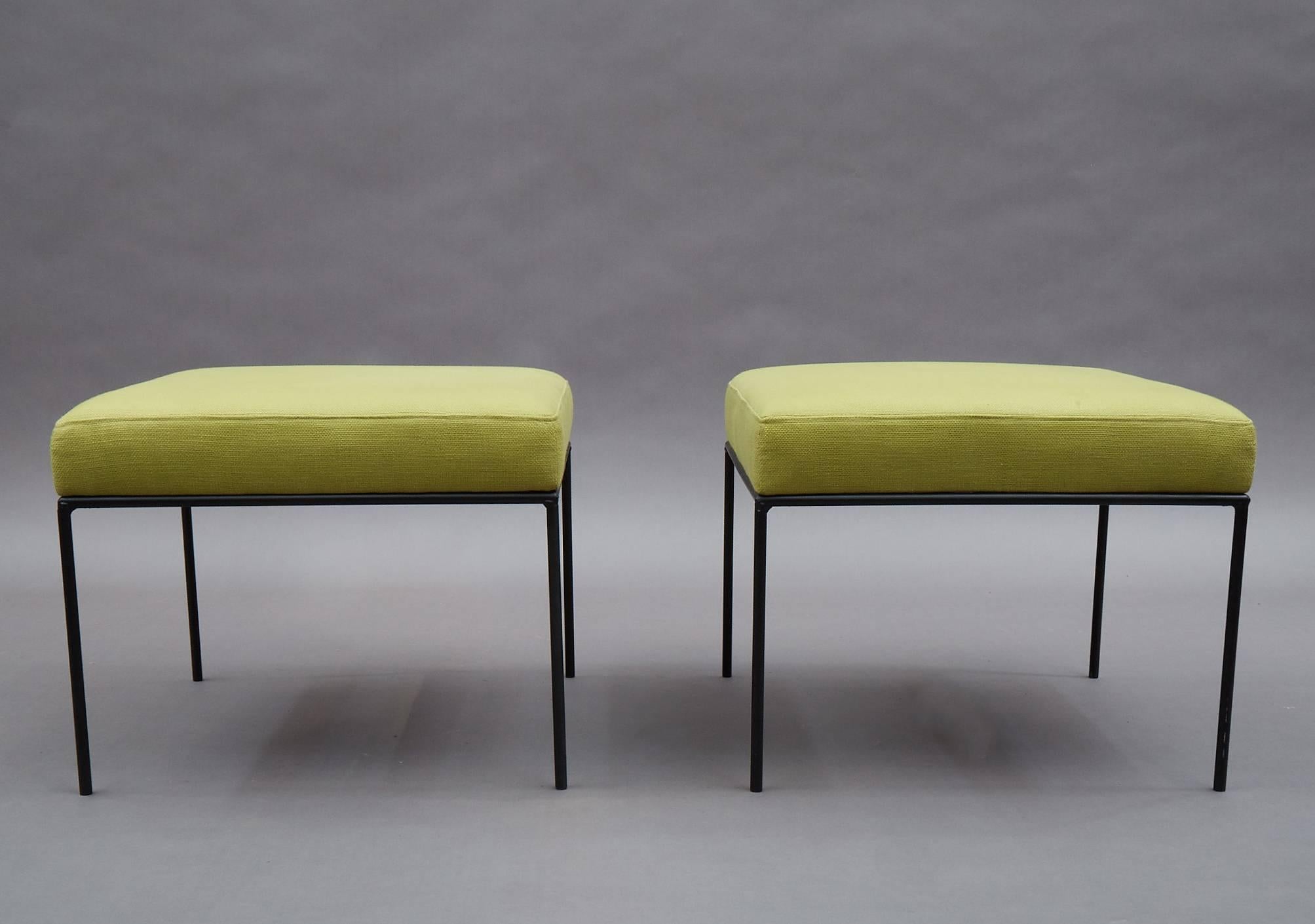 Pair of Mid-Century Modern, low-profile, ottomans or benches by Paul McCobb feature square wrought iron frames and newly upholstered chartreuse linen blend seats.