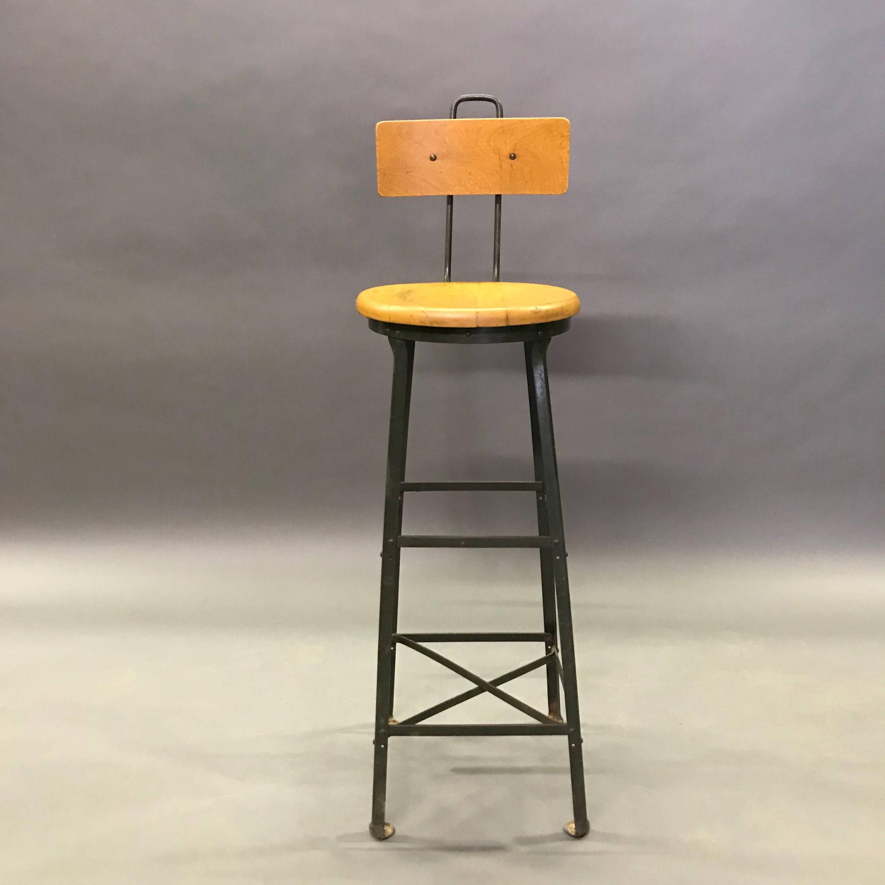 Tall, industrial, railway train station, switchboard operator stool with maple seat and back on a painted steel, angle iron frame.