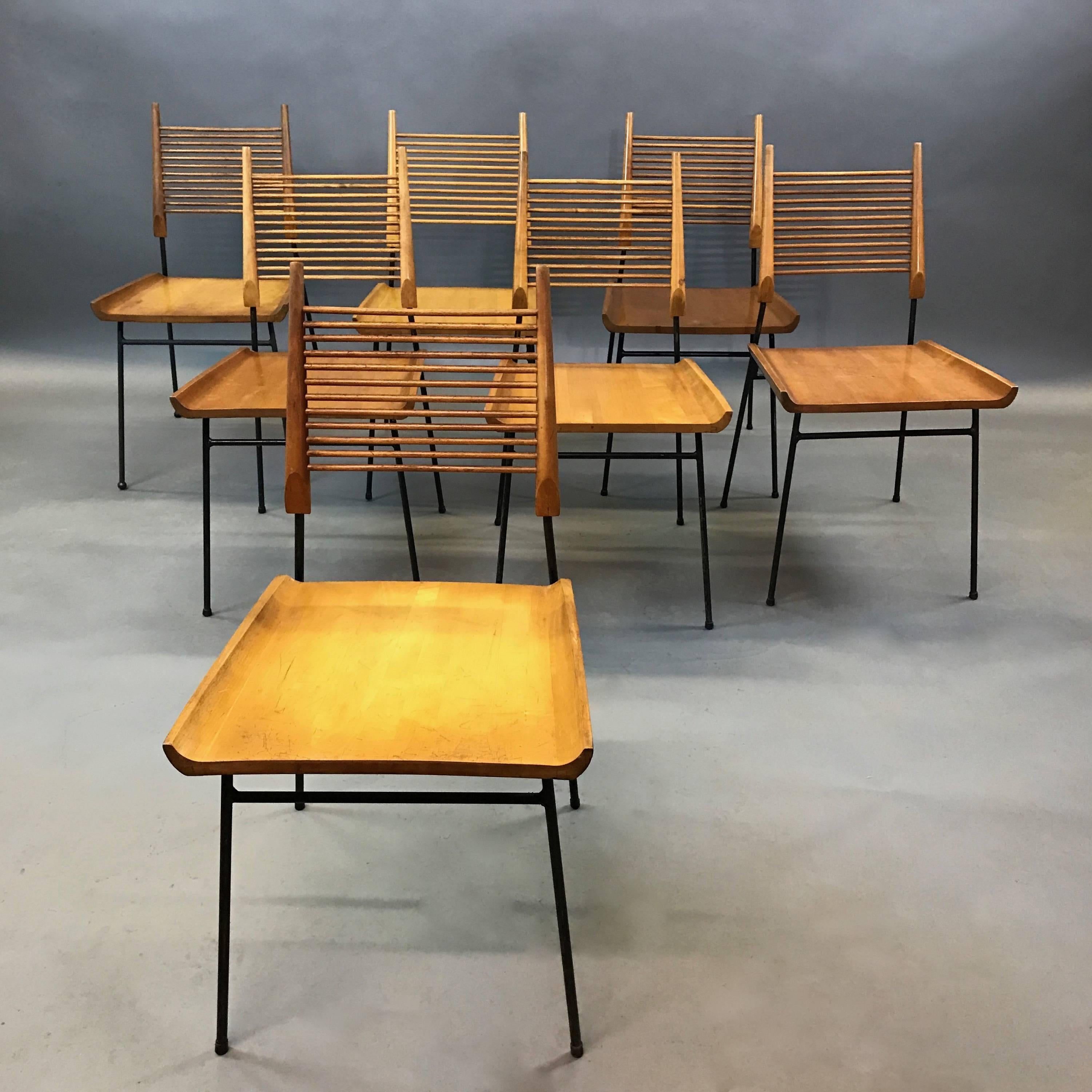 Mid-Century Modern dining chairs designed by Paul McCobb for Winchendon Furniture are scooped maple 