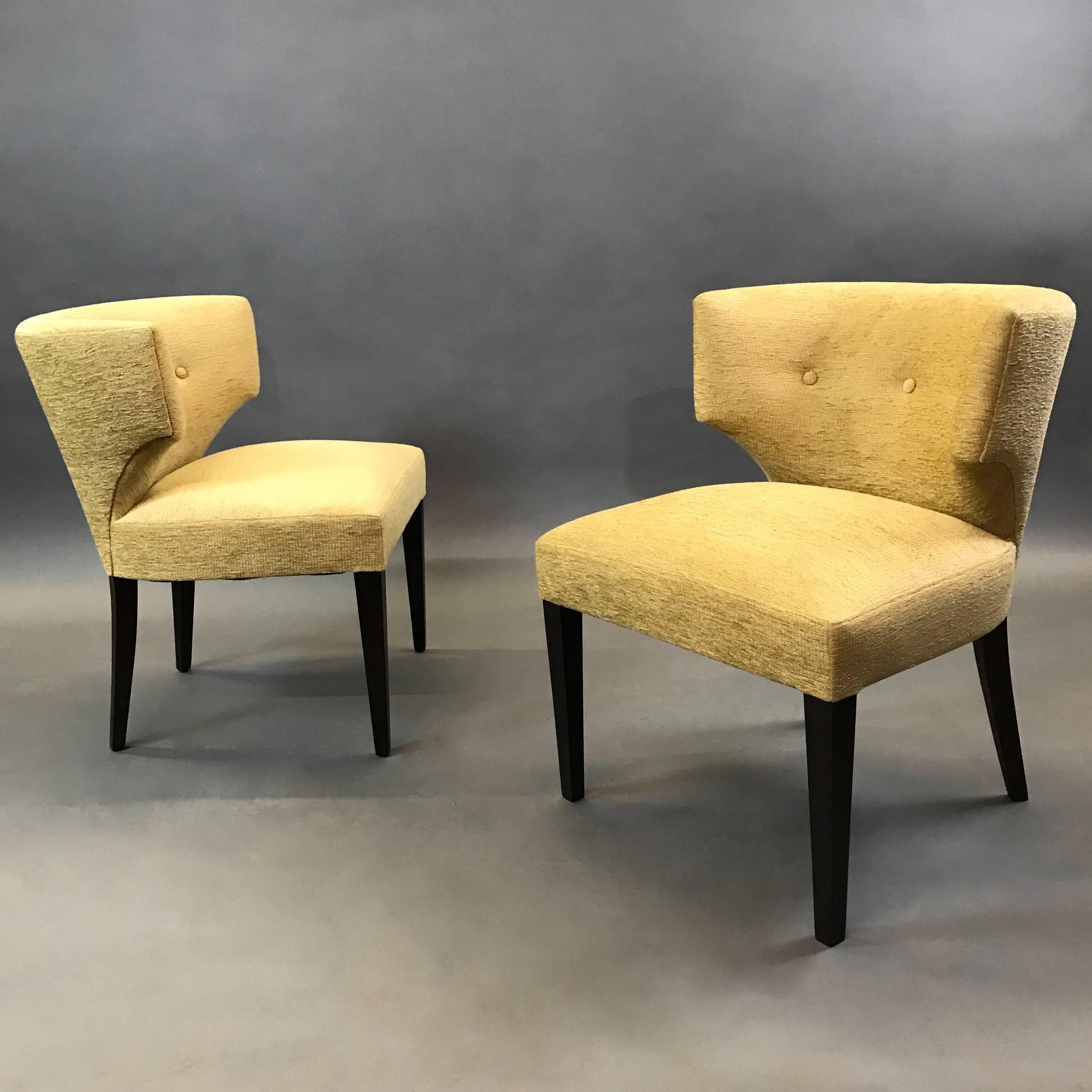 Pair of midcentury, Hollywood Regency, slipper chairs in a Grecian Klismos motif are newly upholstered in buttery chenille with contrasting, black lacquered legs.