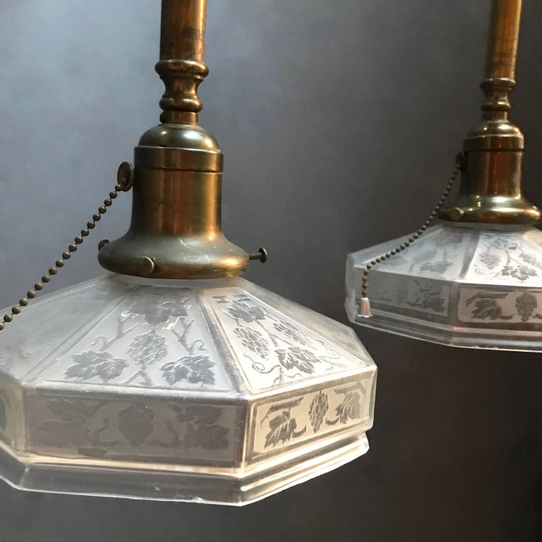 Pair of Industrial Etched Octagonal Glass Pendant Lights on Brass Poles In Excellent Condition For Sale In Brooklyn, NY