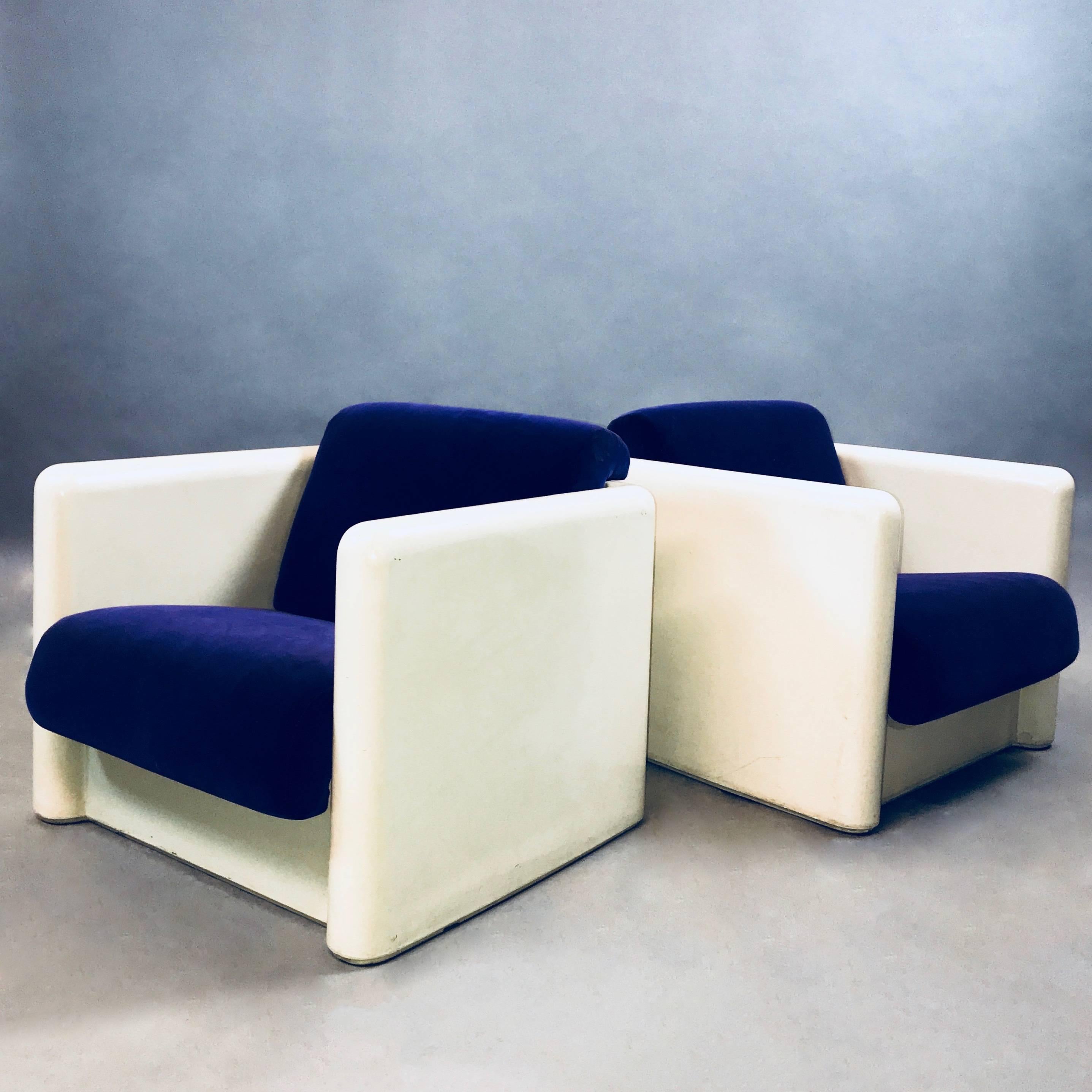 Impressive pair of modernist, molded, white fiberglass, cubed, club, lounge chairs with upholstered seats and backs in striking, deep purple velvet. Seat depth is 19 in.