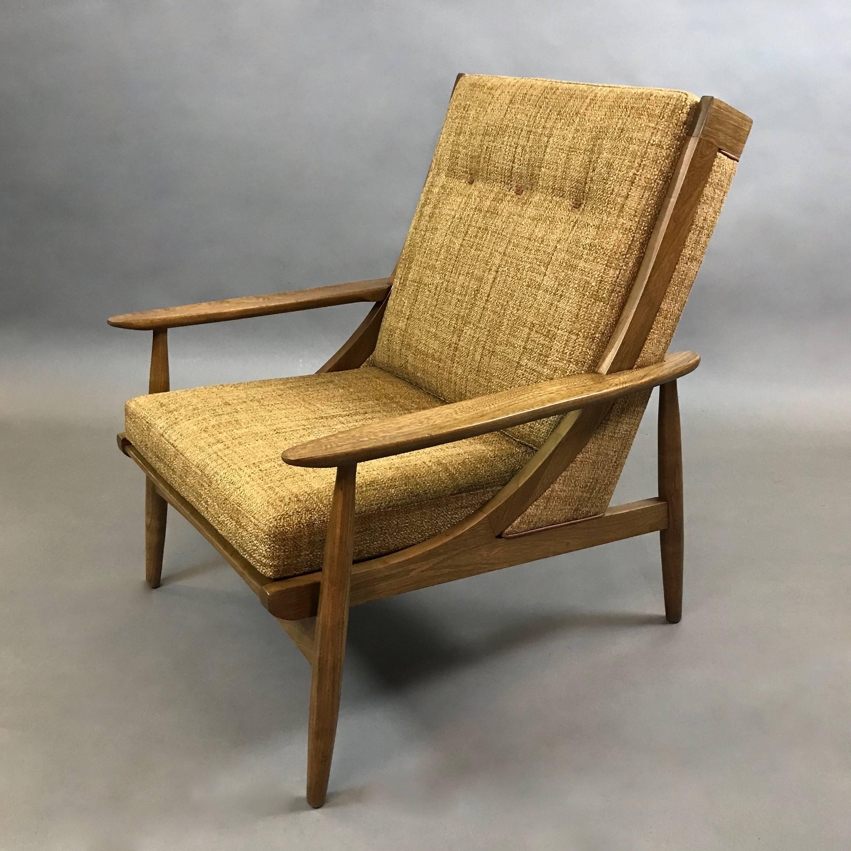 Italian, mid century modern, high, slat back, lounge chair features an ash frame with attached butterscotch tweed blend upholstery accented by tan leather trim and custom leather button details - a stunning chair from all angles.