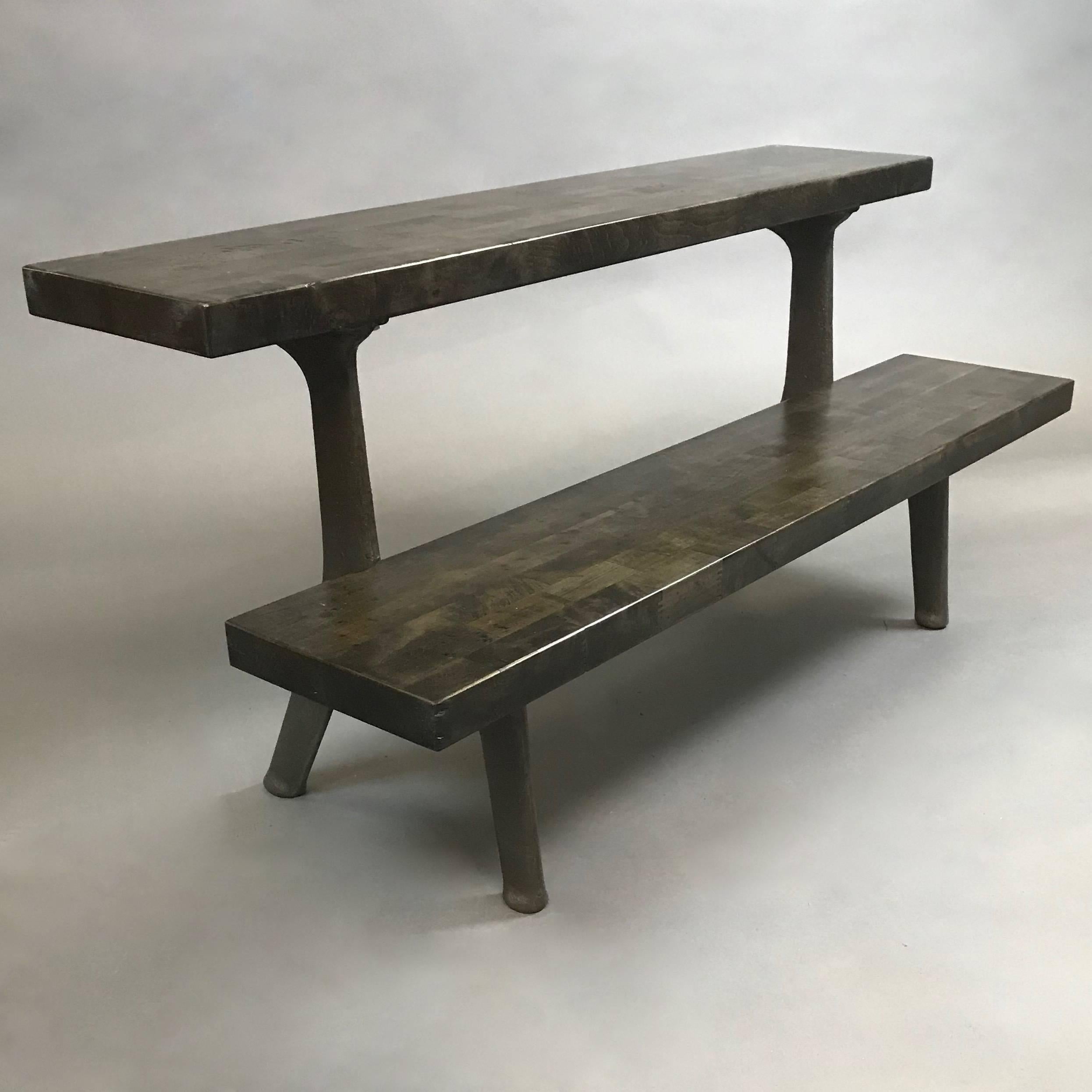 Custom-made, two-tier, bleachers with vintage cast iron frame and reclaimed ebonized maple block shelves. Excellent for display and seating. More can be made to custom size with three weeks lead time.