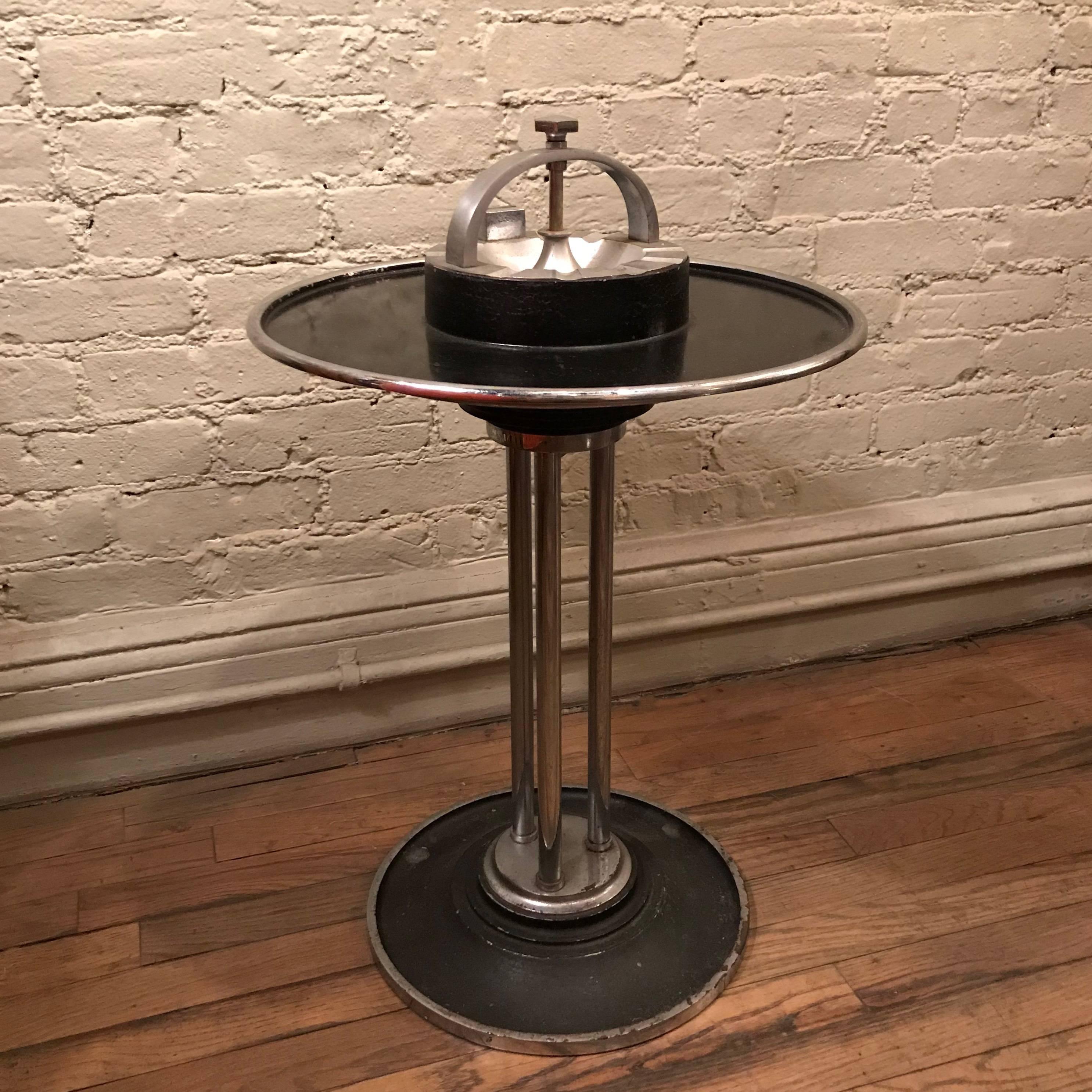 Art Deco, train car, standing ashtray table or cocktail smoker stand by W.J. Campbell Machine Company, Indianapolis, IN. features chrome and aluminum details and a heavy cast iron base. The outer ring is a tray lifts off for easy clearing away.