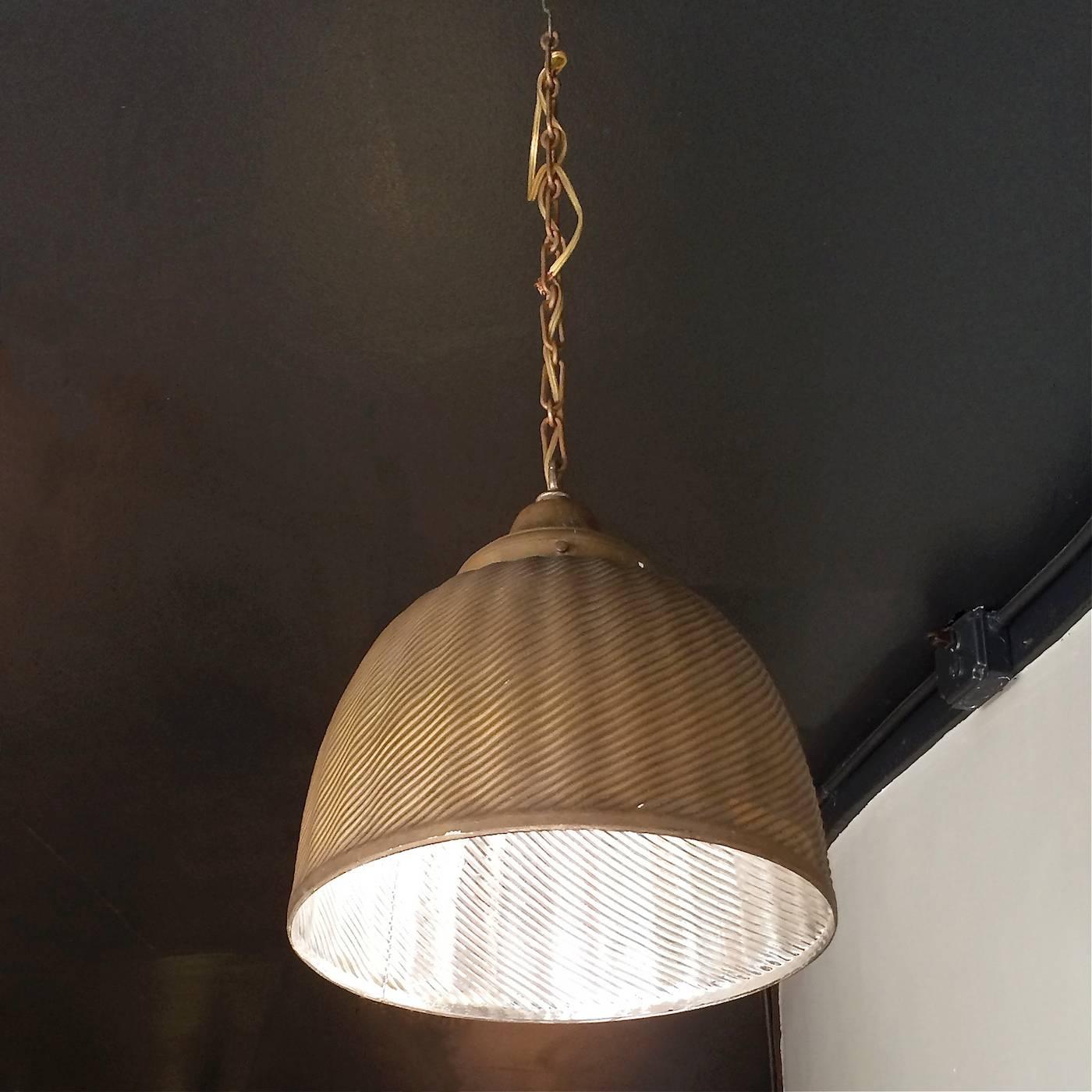 Industrial, mercury glass pendant light by X-Ray lamp company features a painted gold exterior with brass fitter and chain. Gold exterior paint is very intact. The chain length can be adjusted. The pendant is wired to accept up to a 150 watt bulb.