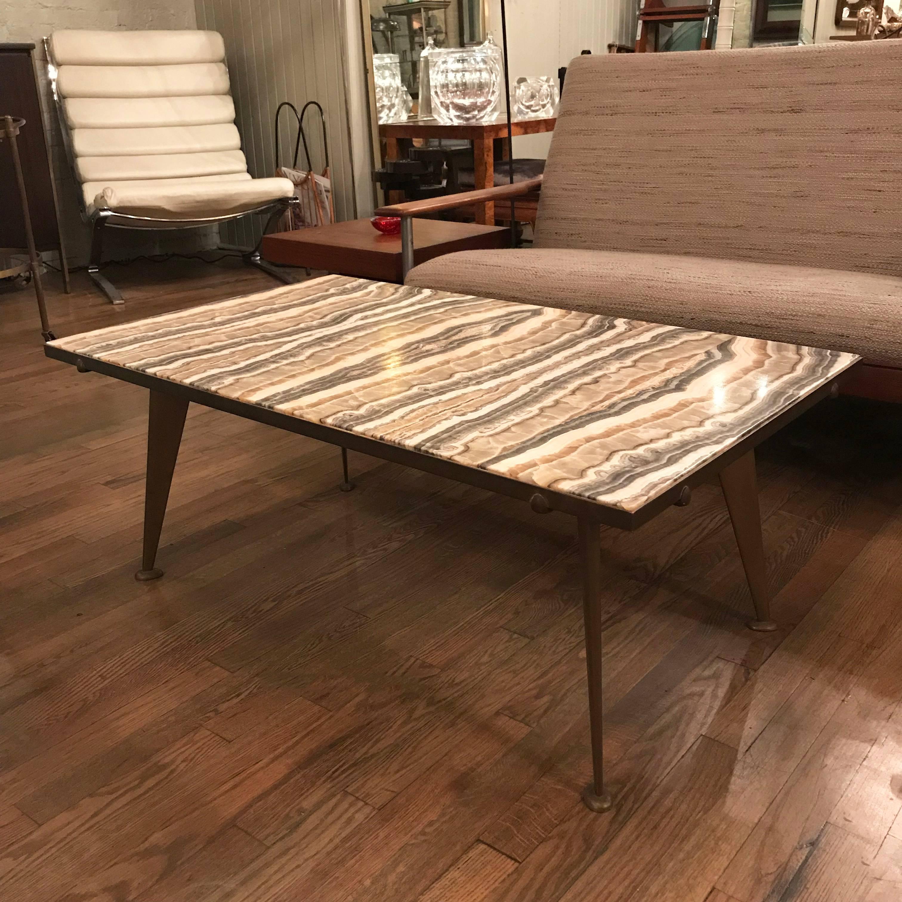 Rare, stunning, coffee table with book matched quartz top and bronze frame designed by the artist Richard Almond Blow circa 1950's. The table is marked Made In Italy with with his Montici 