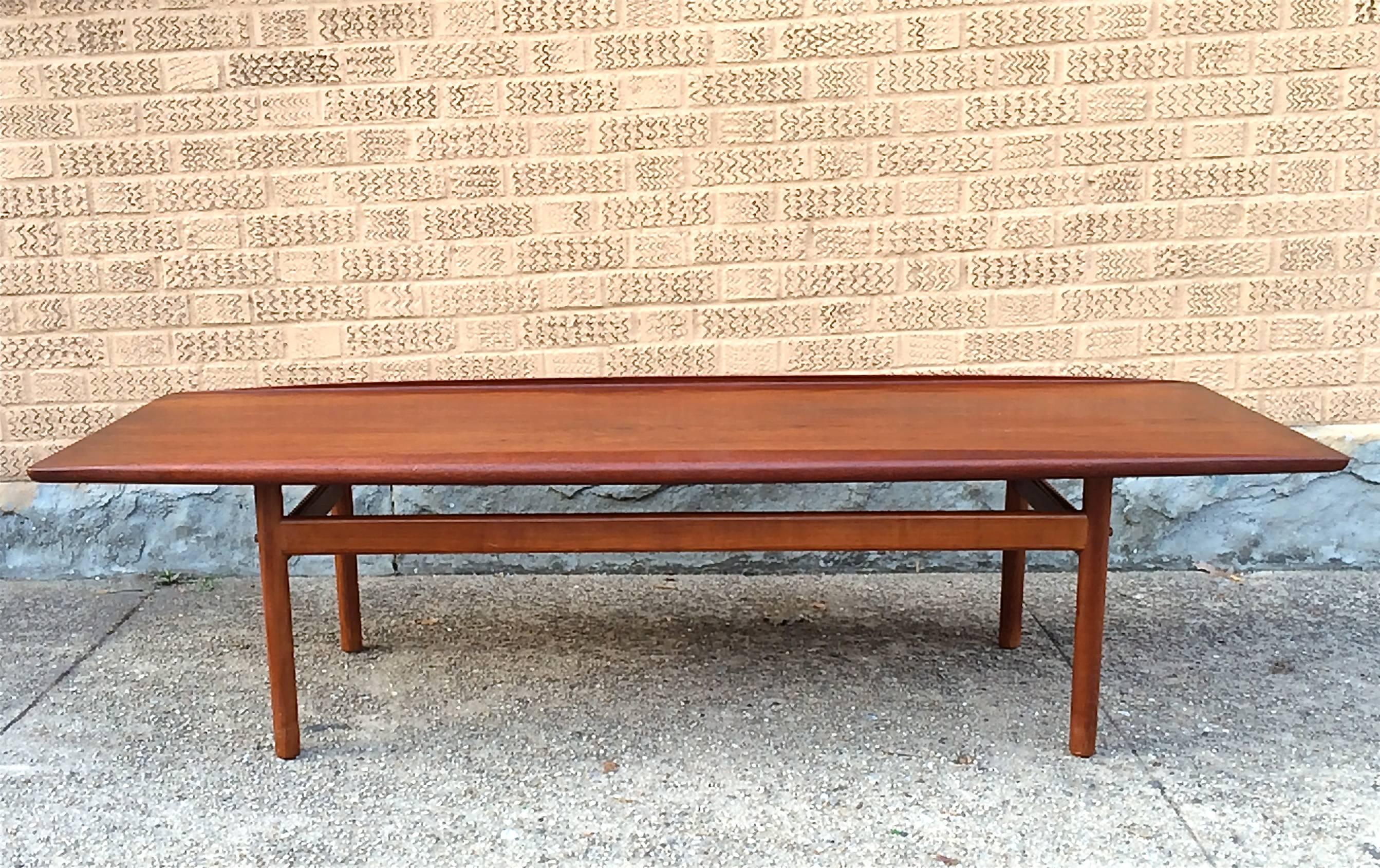 Solid teak, coffee table by DUX with slightly upturned edges attributed to Folke Ohlsson.