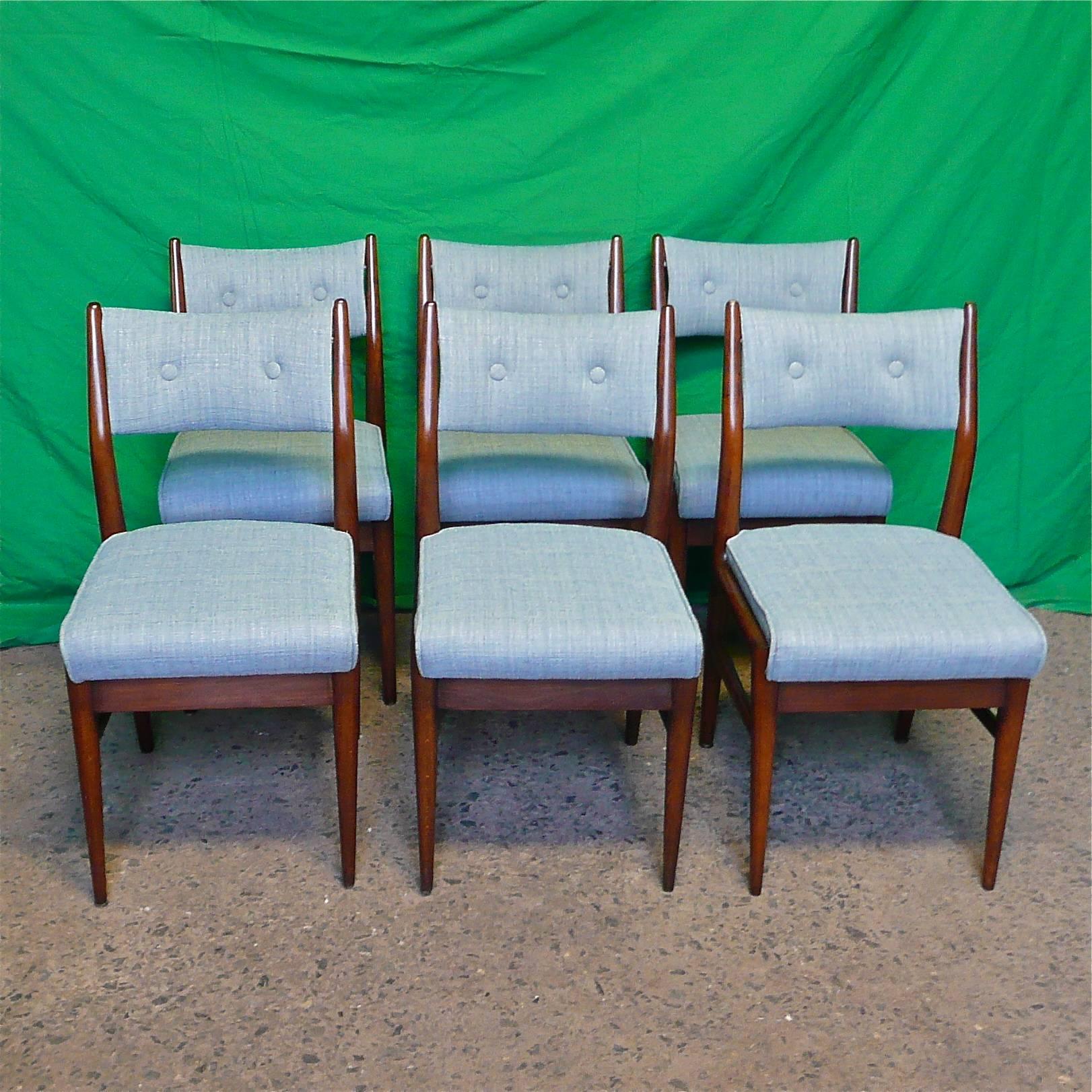 Set of 6, mid-century modern, walnut dining chairs in the manner of Gio Ponti are fully restored with a light blue woven cotton blend fabric