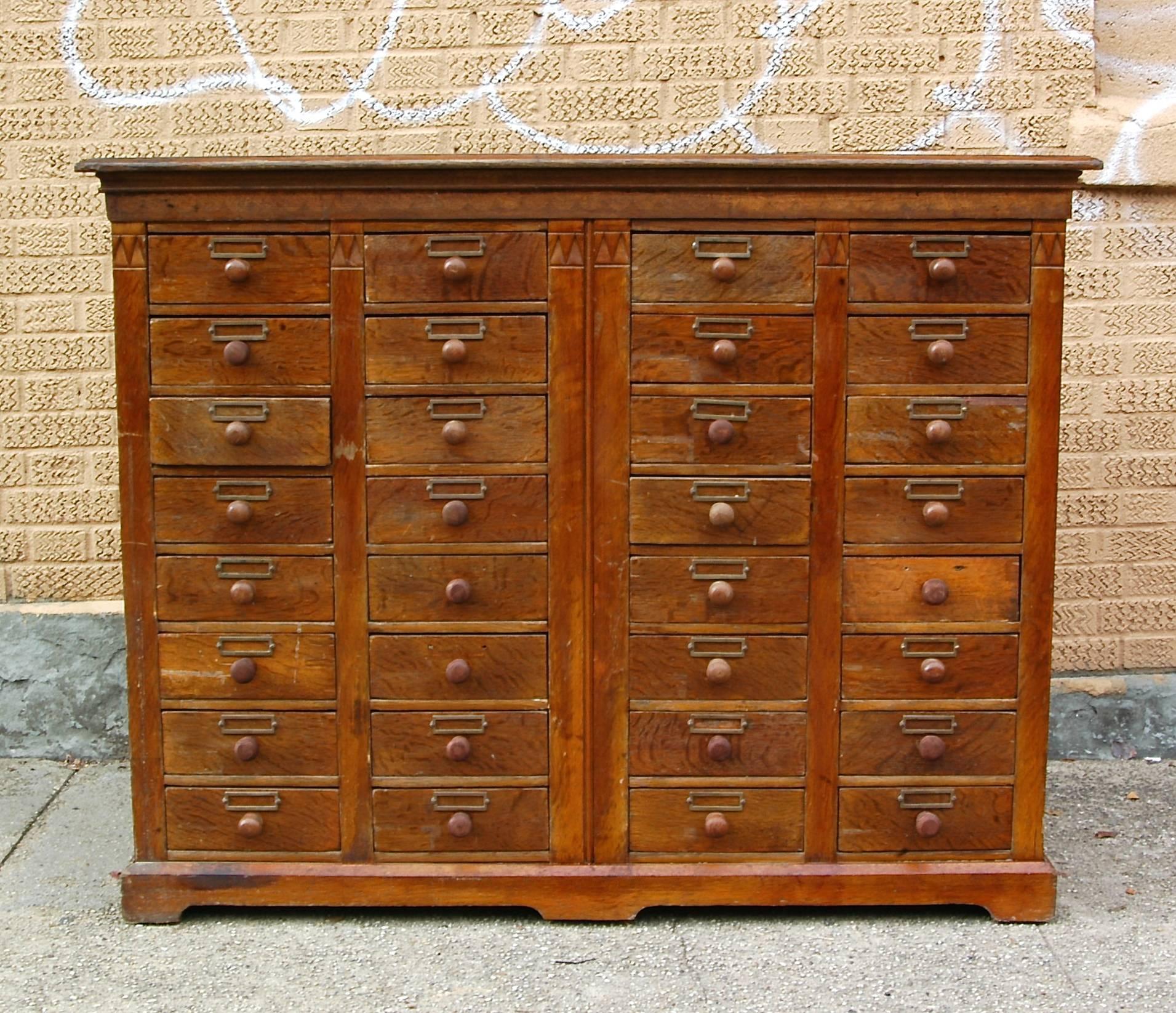 Nicely detailed, antique, oak, apothecary medicine cabinet with 32 drawers

55 inches w x 19.5 inches d x 43 inches; ht, drawers are 9 inches w x 3 inches ht x 14 inches d