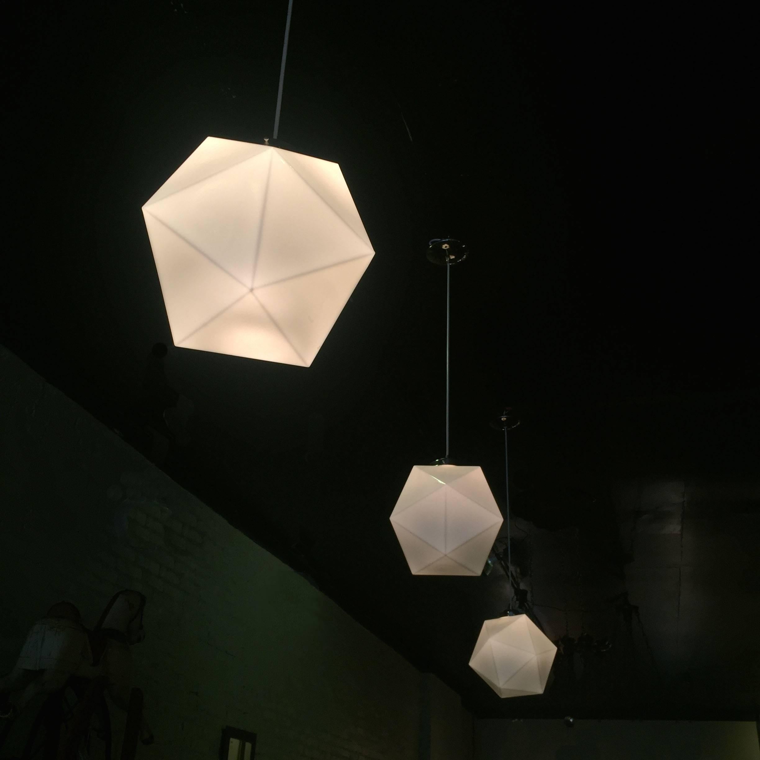 One spectacular, Mid-Century Modern, 20 sided polygon, faceted, milk glass, geometric form, pendant light with chrome fitters and canopies.