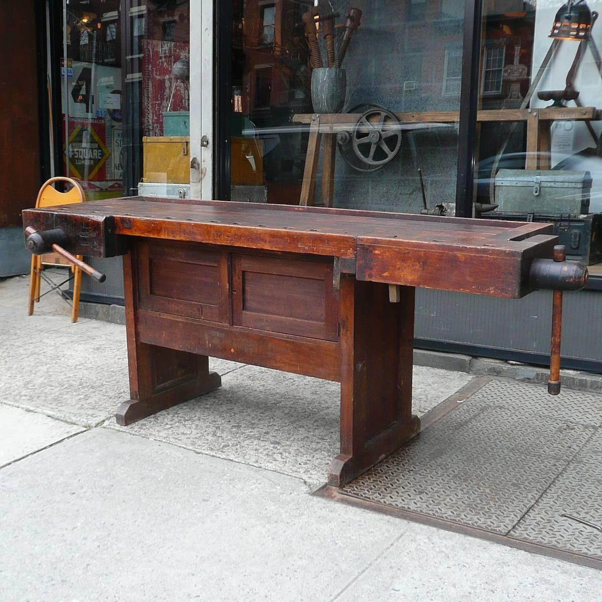Rustic, maple and walnut, cabinet maker’s work bench with storage and working vices attributed to Hammacher Schlemmer.