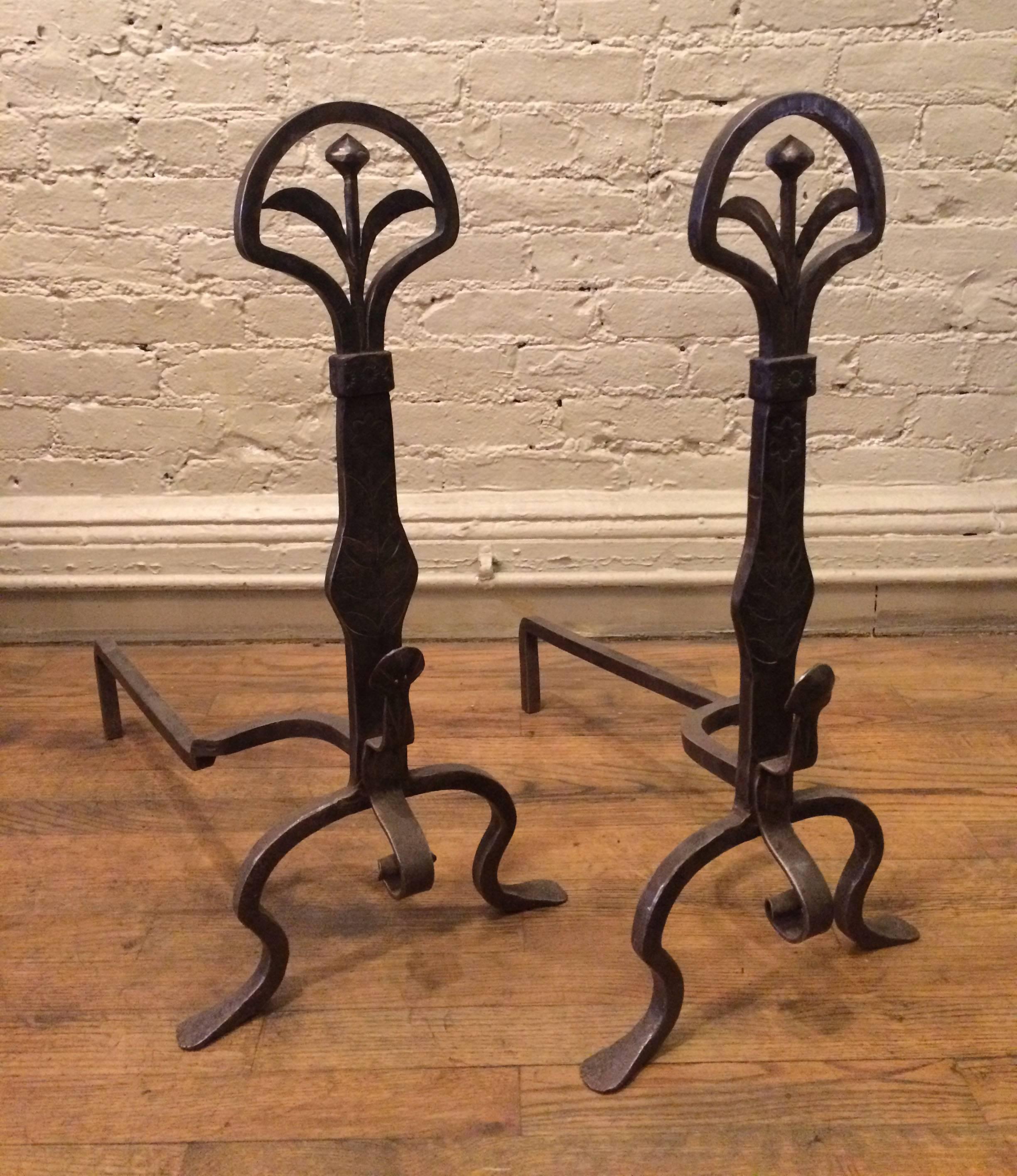 Pair of stunning, Victorian, wrought iron andirons with floral finals and hand tooled design.