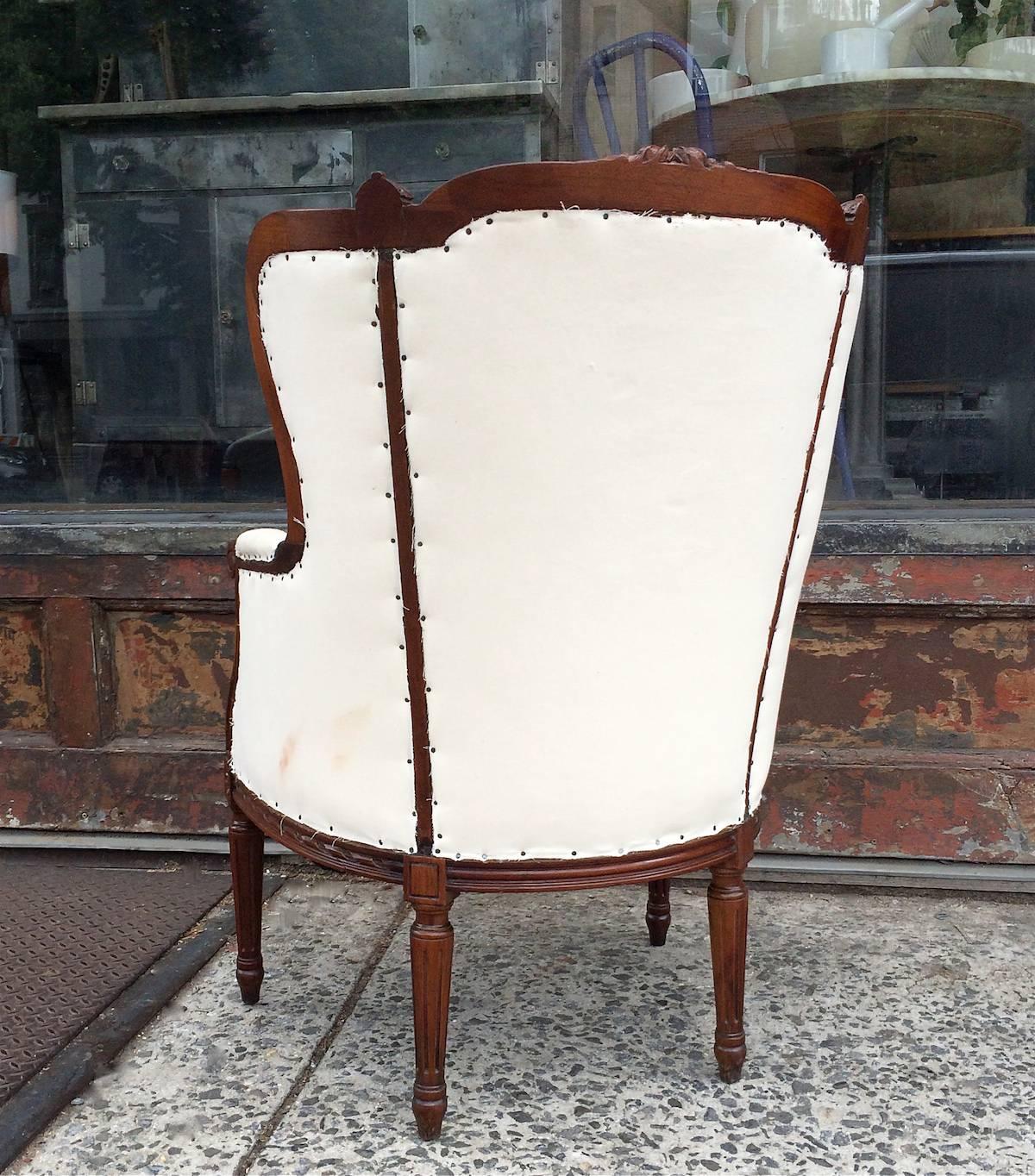 Mid-20th Century Carved Mahogany Wingback Armchair