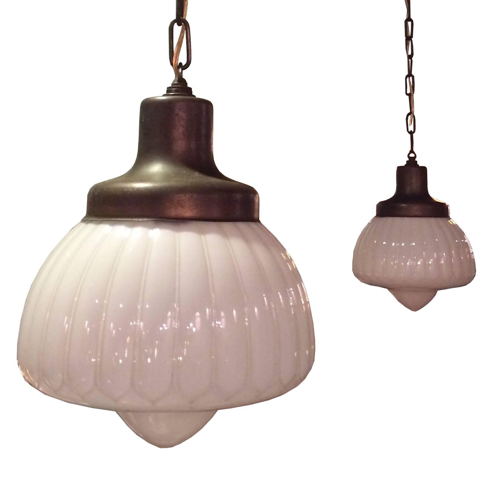 Set of 3 fancy, fluted milk glass library / pharmacy pendant lights with matching copper plated fitters, chains and canopies.