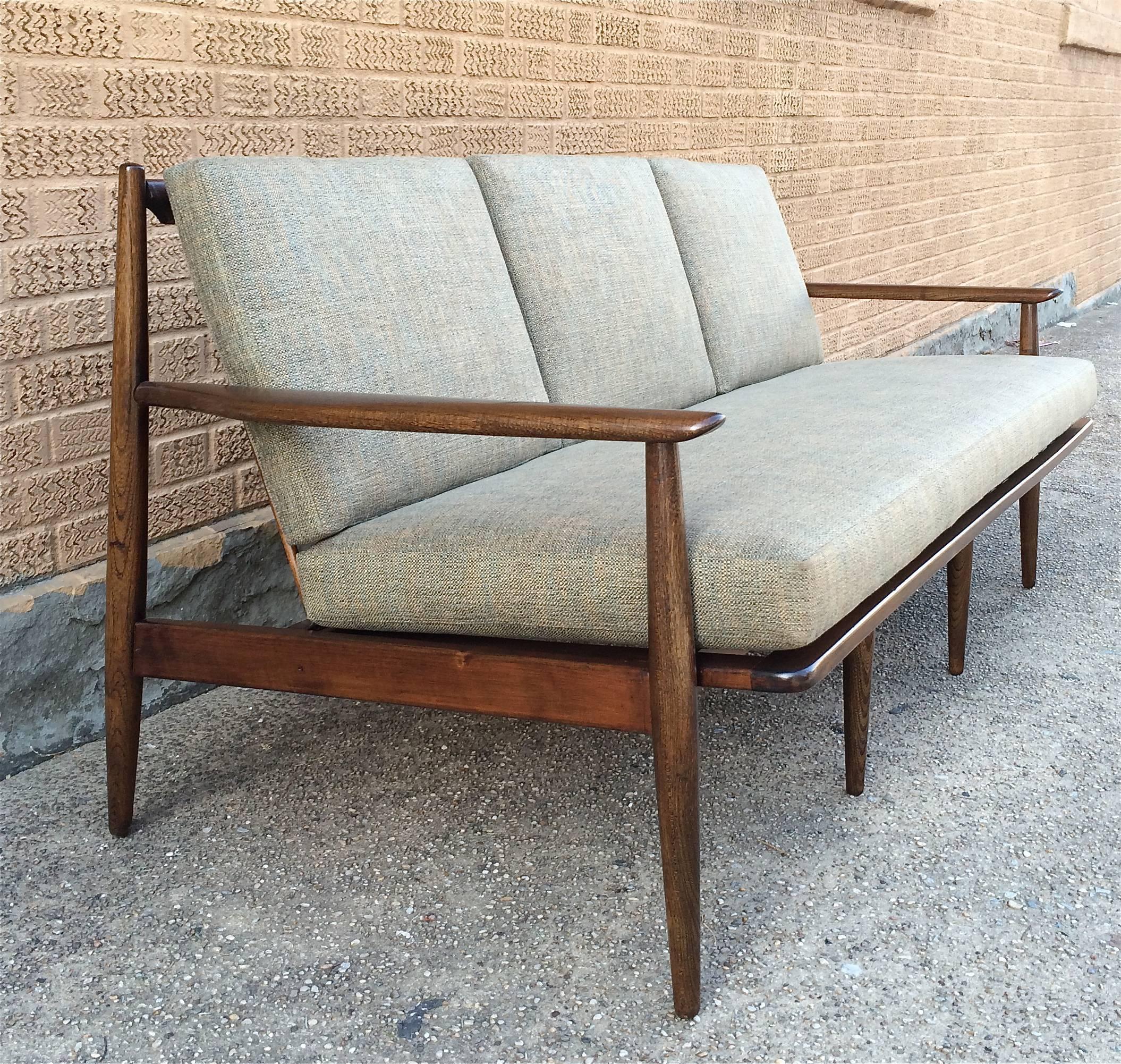 Danish modern, walnut frame sofa by Ib Kofod-Larsen is newly upholstered in a woven linen blend.