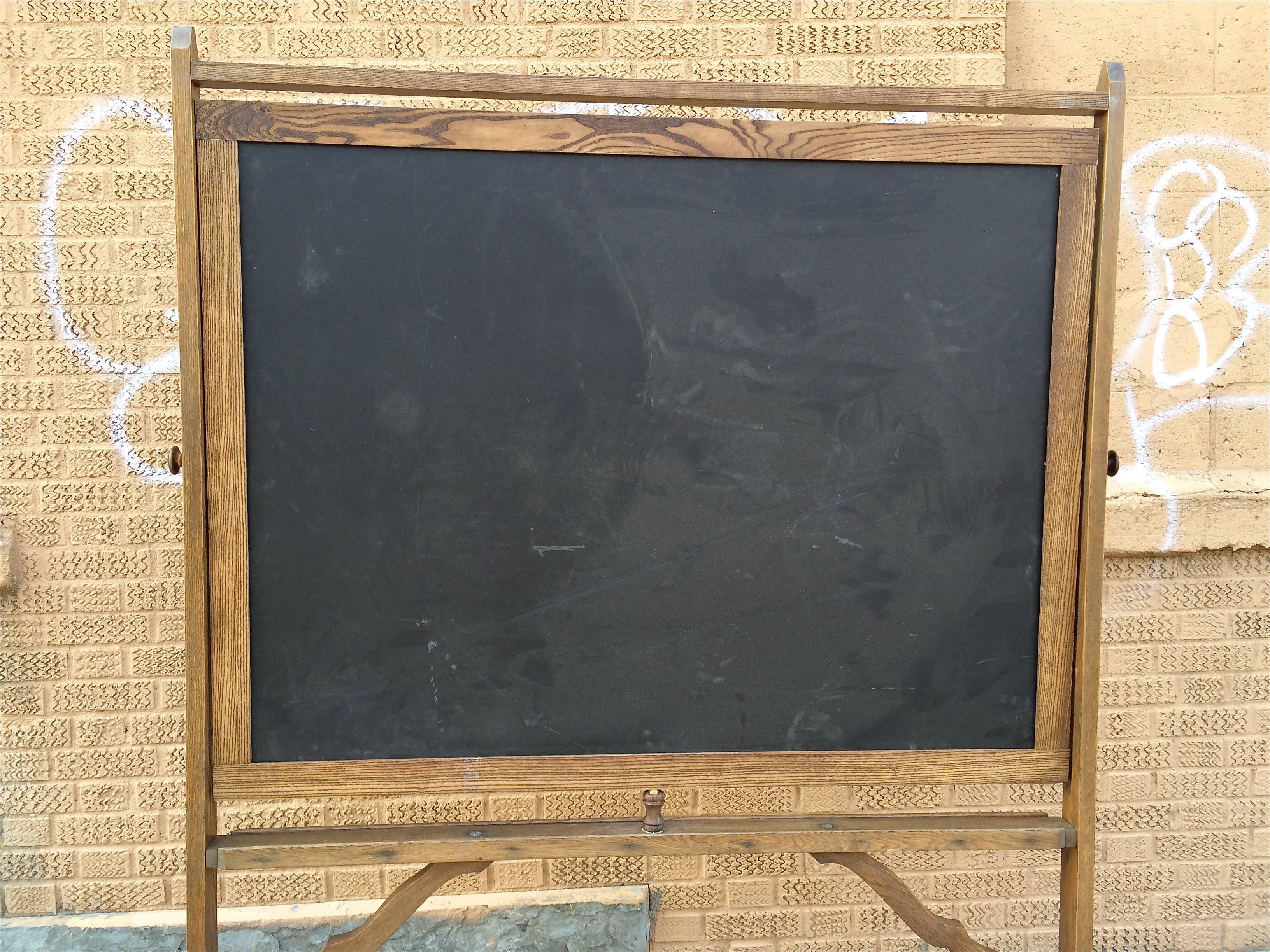 Nicely detailed, 1930s, maple frame, rolling, double sided, schoolhouse standing chalkboard or blackboard.

58