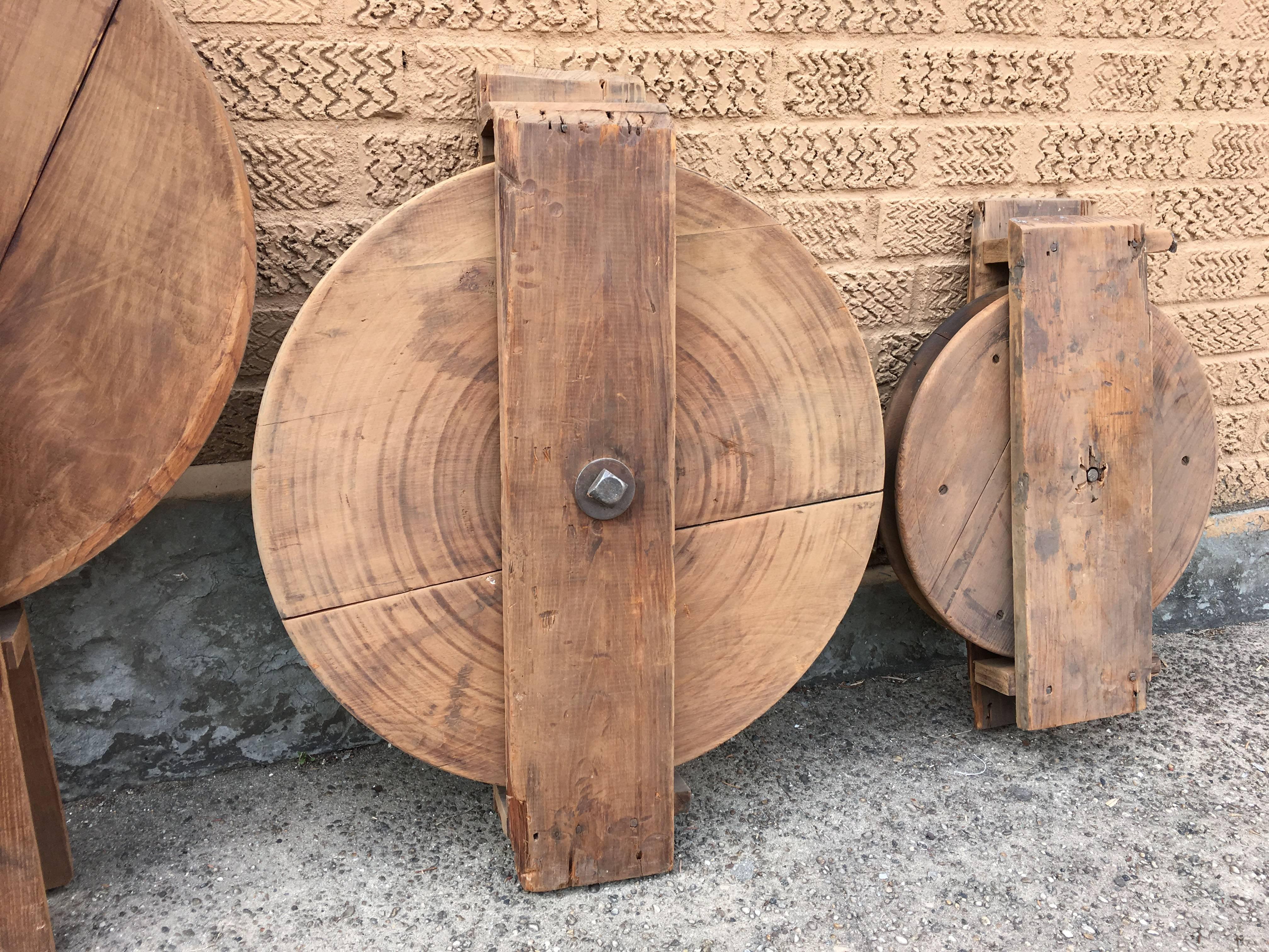 Collection of two, large and small, maple, dumb waiter pulleys circa late 19th century are unique, Industrial objects.

Large pulley is 38" x 22".
Small pulley is 22" x 15".