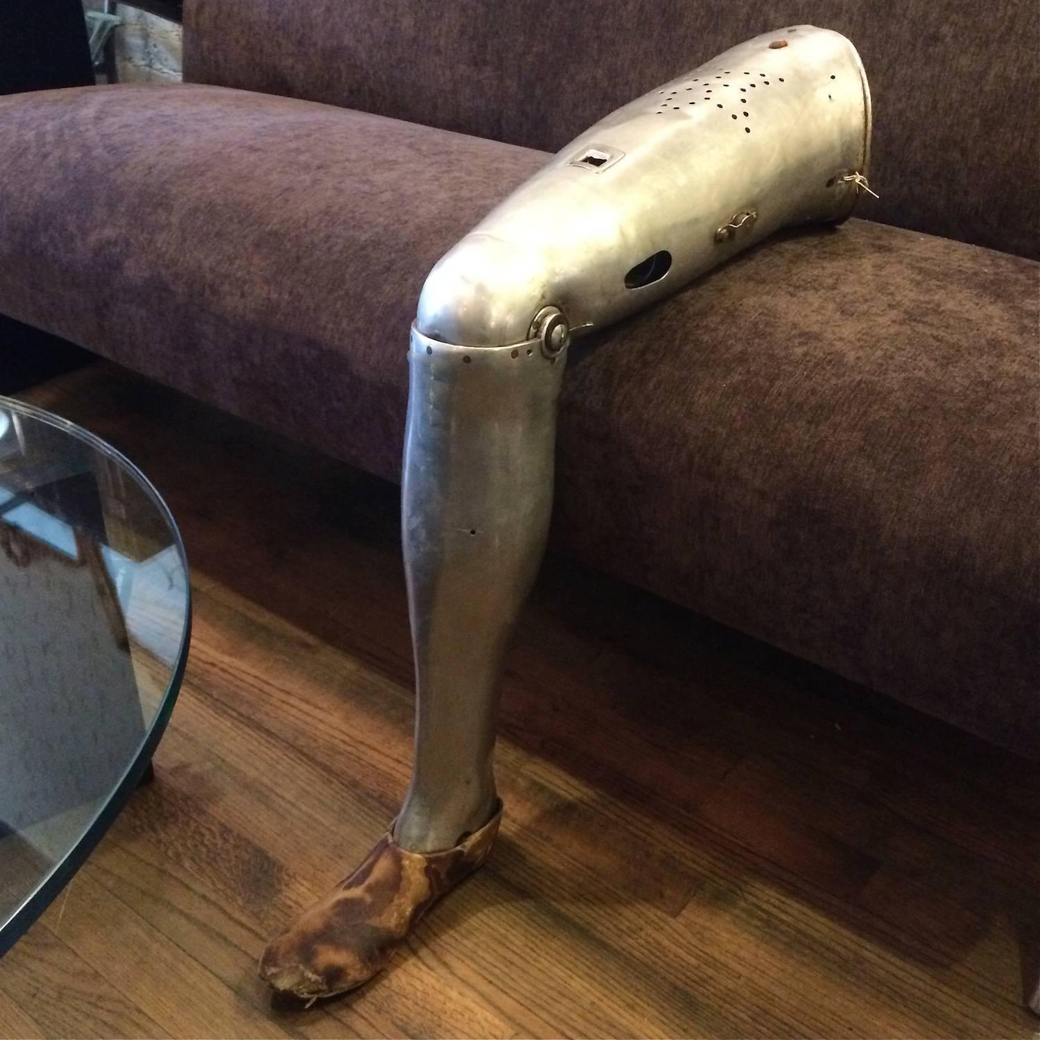 WWII, aluminum, prosthetic military officer’s leg with leather foot, circa 1940.