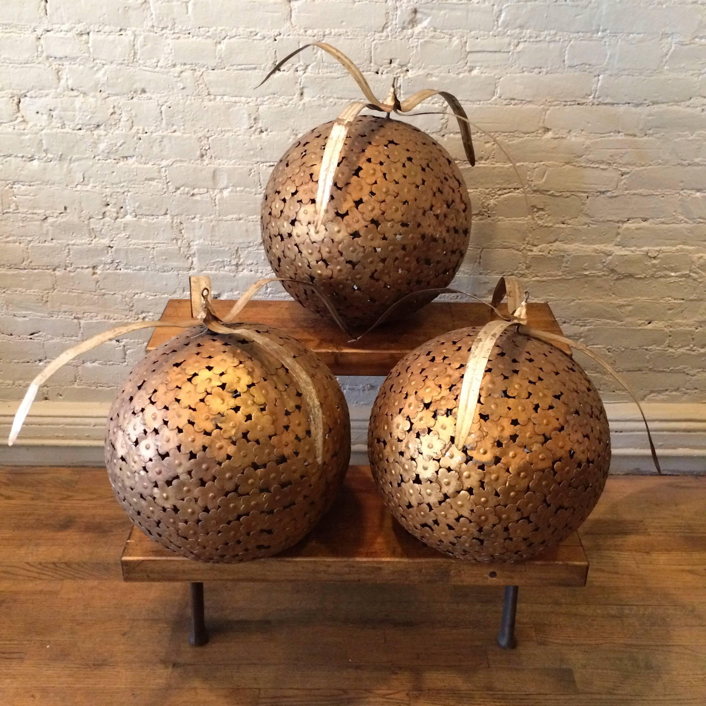 Set of three, large, painted steel and decorative ball ornaments from Macy’s Department store display, circa 1960s.