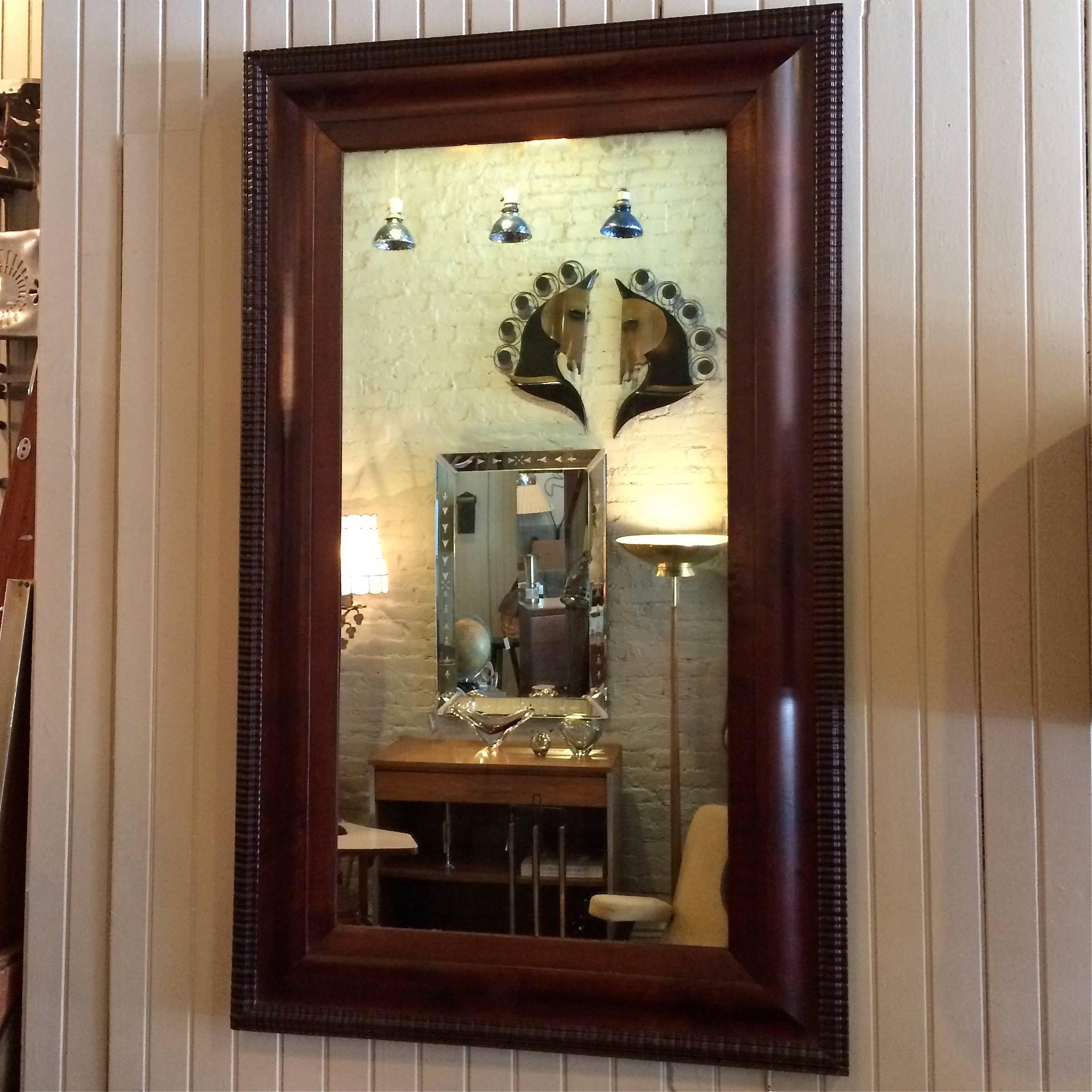 Nicely detailed, antique, regency wall mirror features a carved, mahogany, picture frame circa 1890s.