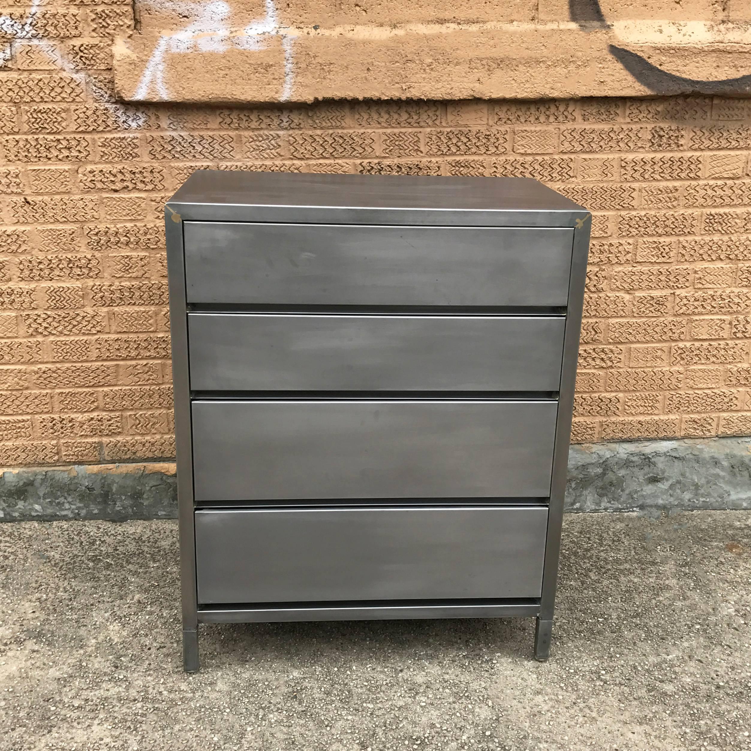 Mid-Century, machine age, brushed steel dresser by Superior Sleeprite Corp, Chicago, IL features four streamlined drawers.