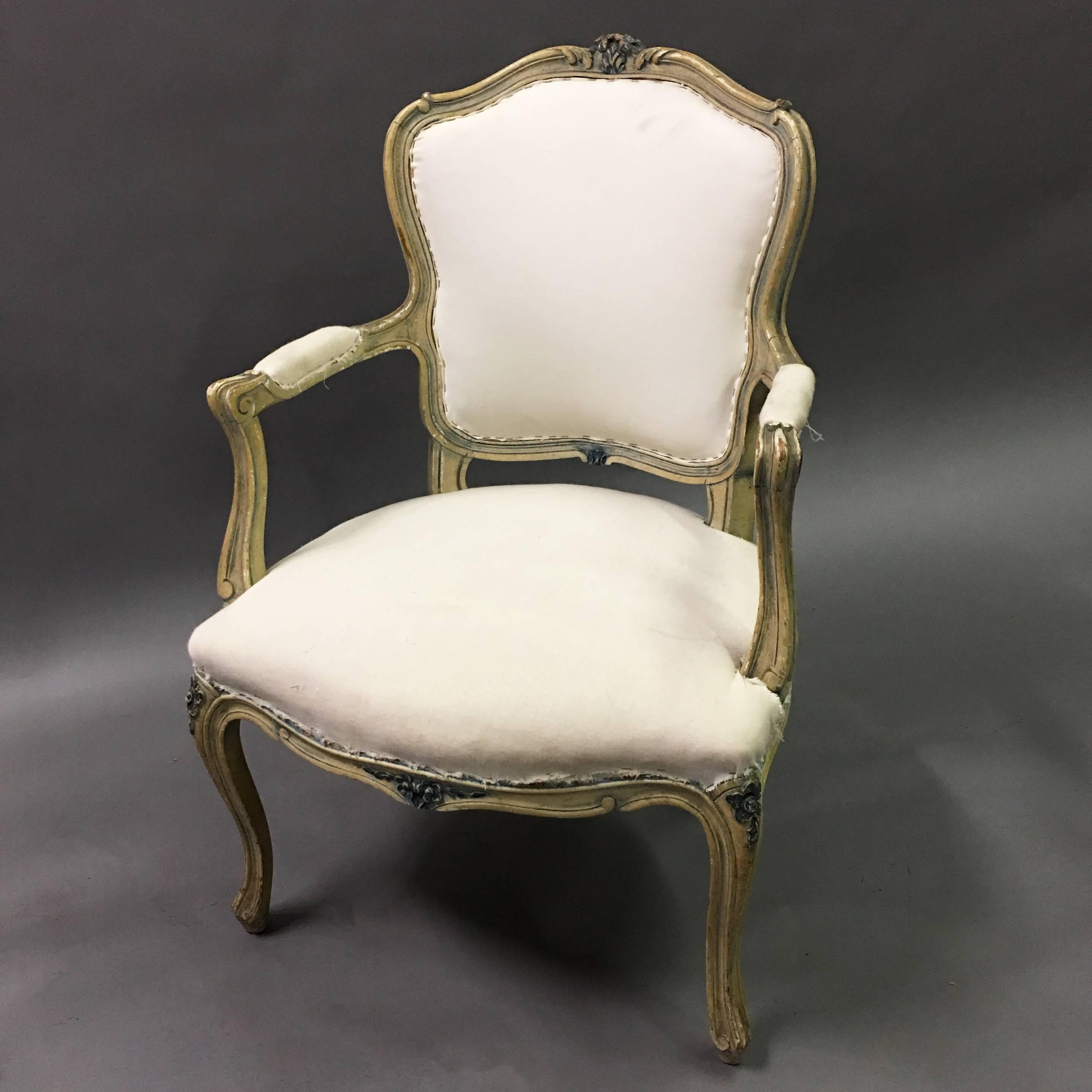 Louis XVI style, armchair features a beautifully carved mahogany frame with it's original patina and new underpinnings with muslin fabric. The chair can be used as is or upholstered for an additional fee. The arm height is 24 in.