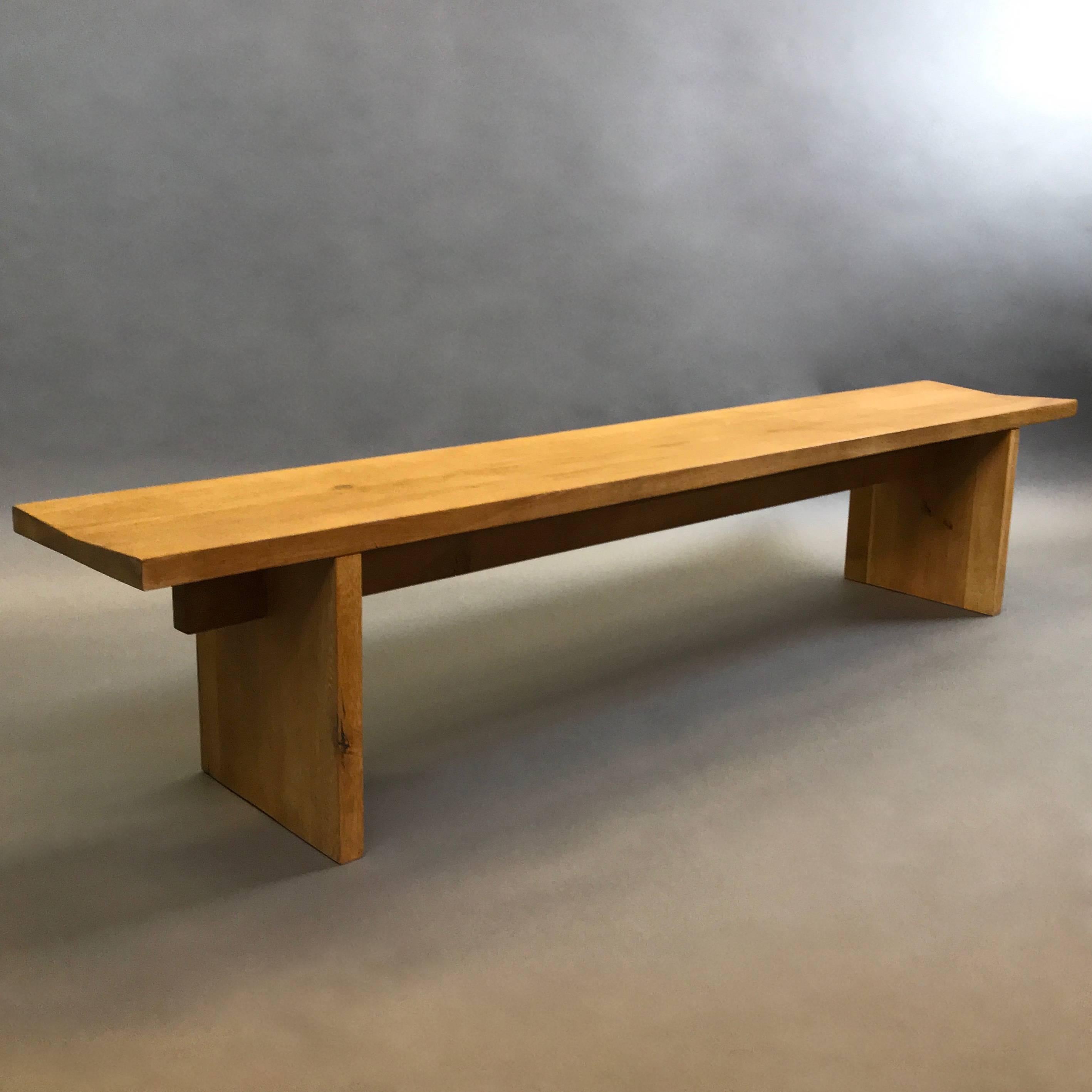 Minimal, craftsman made, oak bench, circa 1970s features free-range, organic lines with stretcher / joist detail.