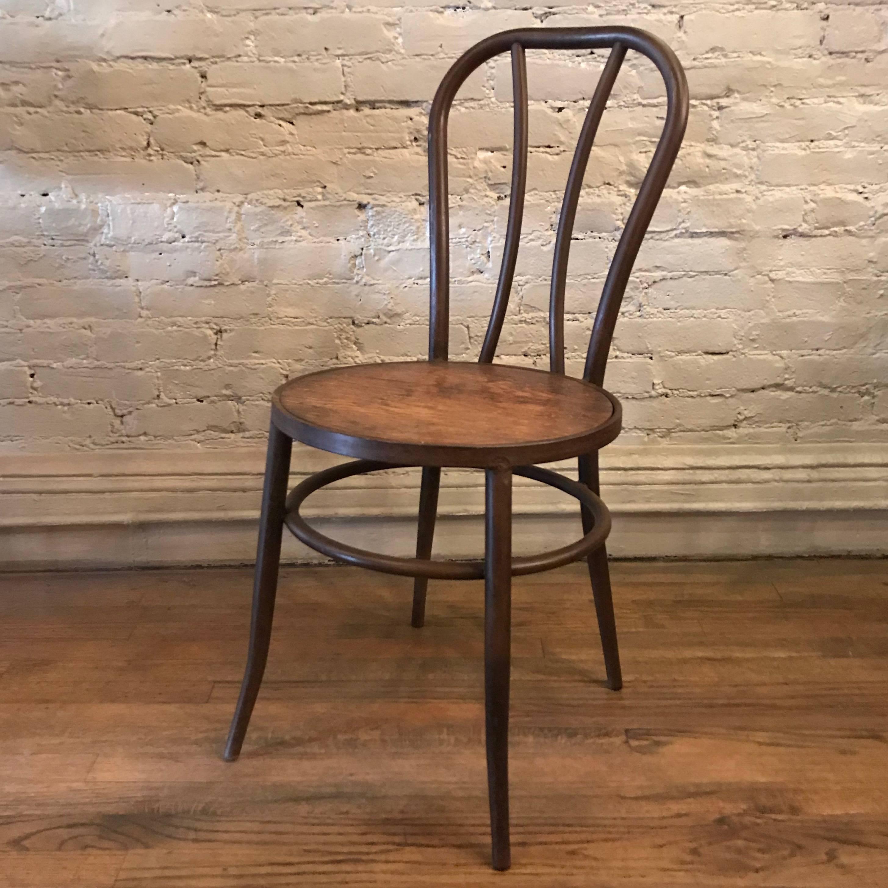 Thonet, café, side chair, circa 1920s features a tubular iron frame with plywood seat.