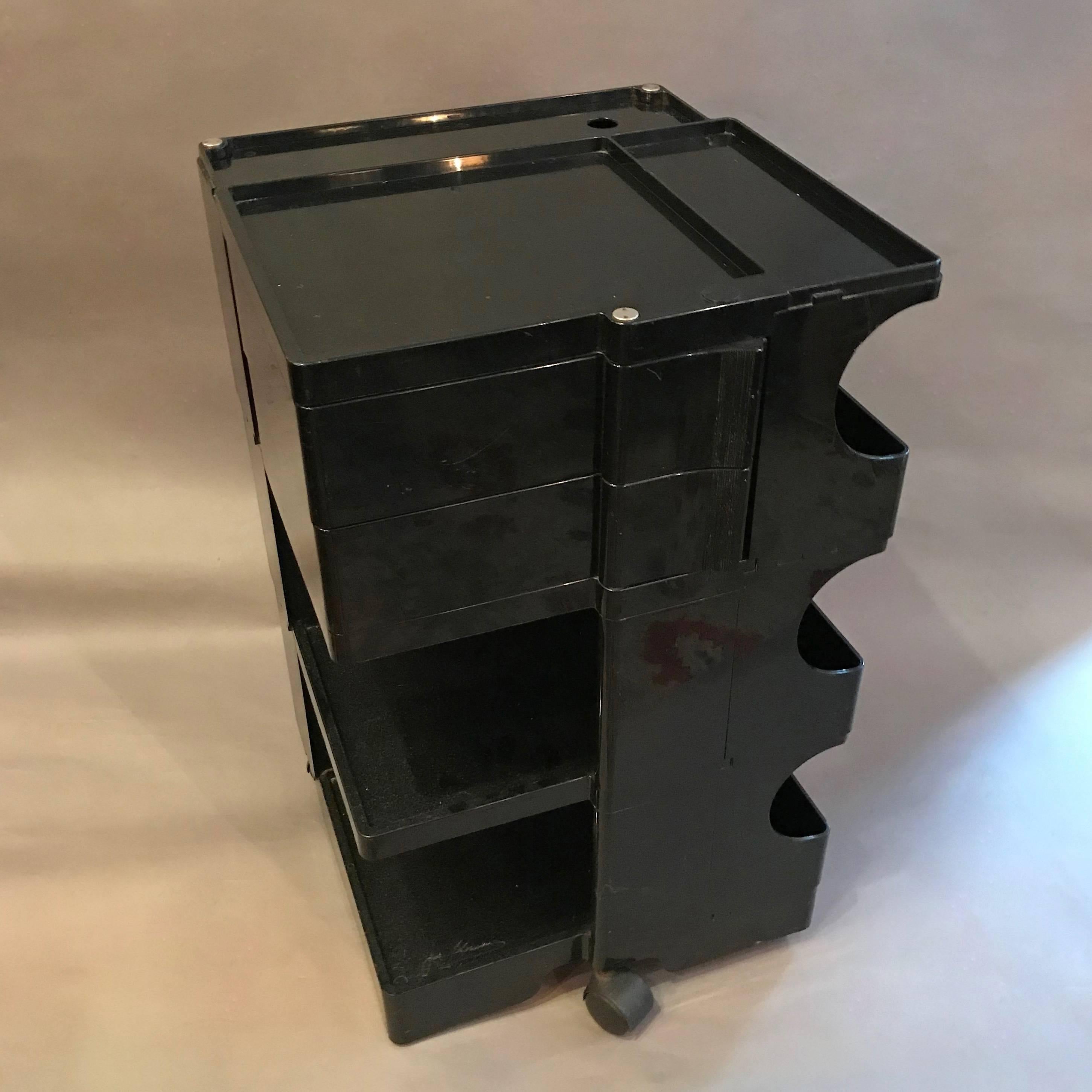 Mid-Century Modern, black plastic, storage system Boby cart by Joe Colombo features sides of shelves, bins, pivoting trays and slots. It was designed as a work station but it can be used for anything; bar caddy or nightstand, etc.