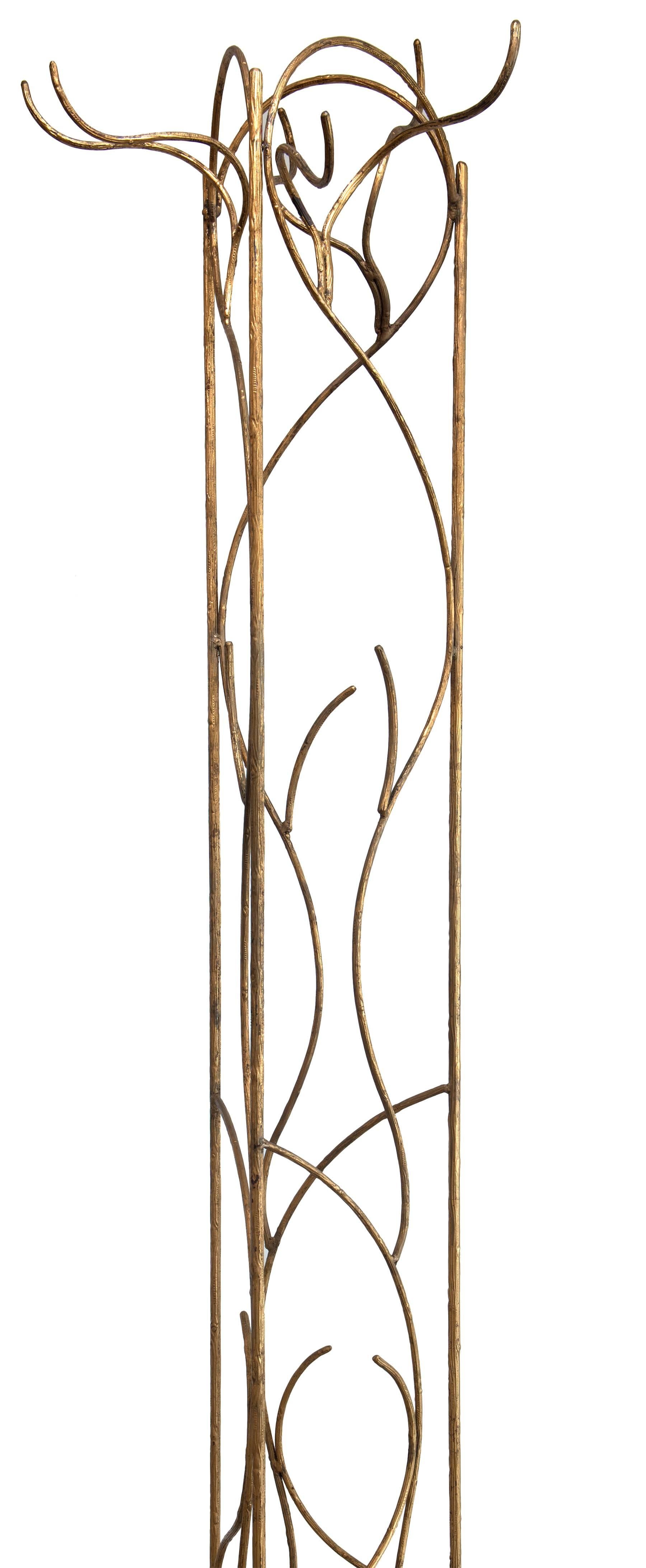 Pair of vintage wrought iron and gold leafed store displays. Tooled detail to simulate wood branches. They each stand sturdily on their own. Would make a great coat rack system for a dressing room or an architectural detail.

1. 86" x